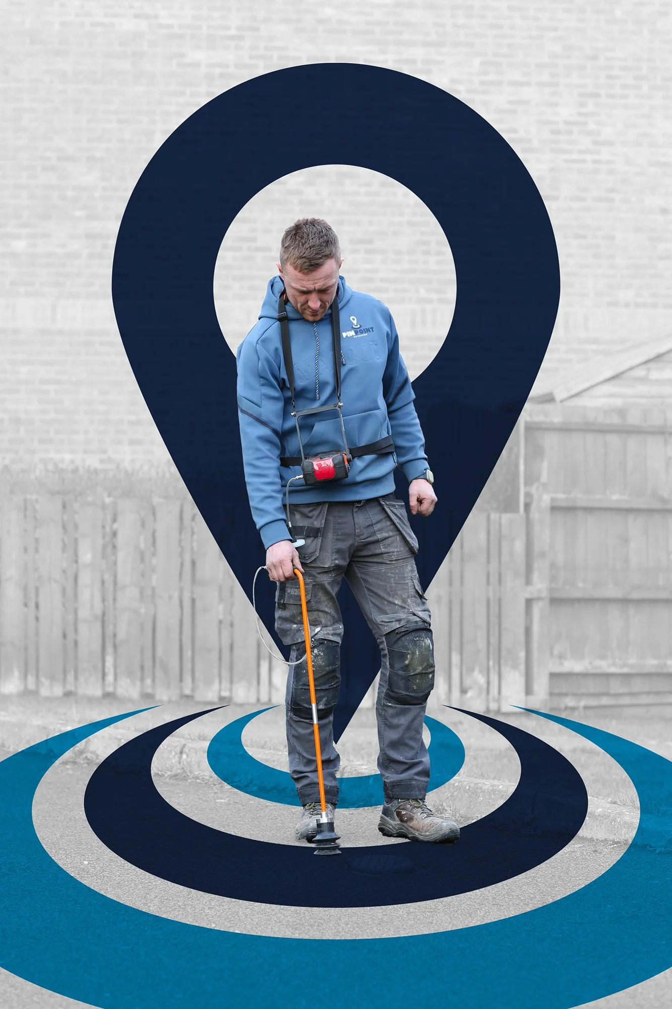 A man standing outdoors on a paved surface, holding a metal detector, with a large graphic of a location pin and concentric circles in blue and gray, creating a layered design behind him.