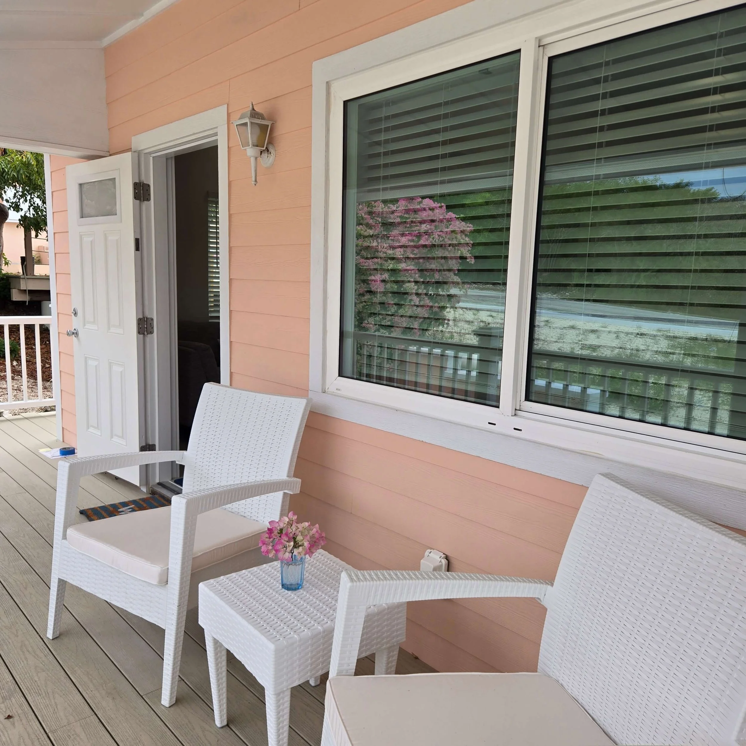 Sea Shell private entrance and porch surrounded by bougainvillea
