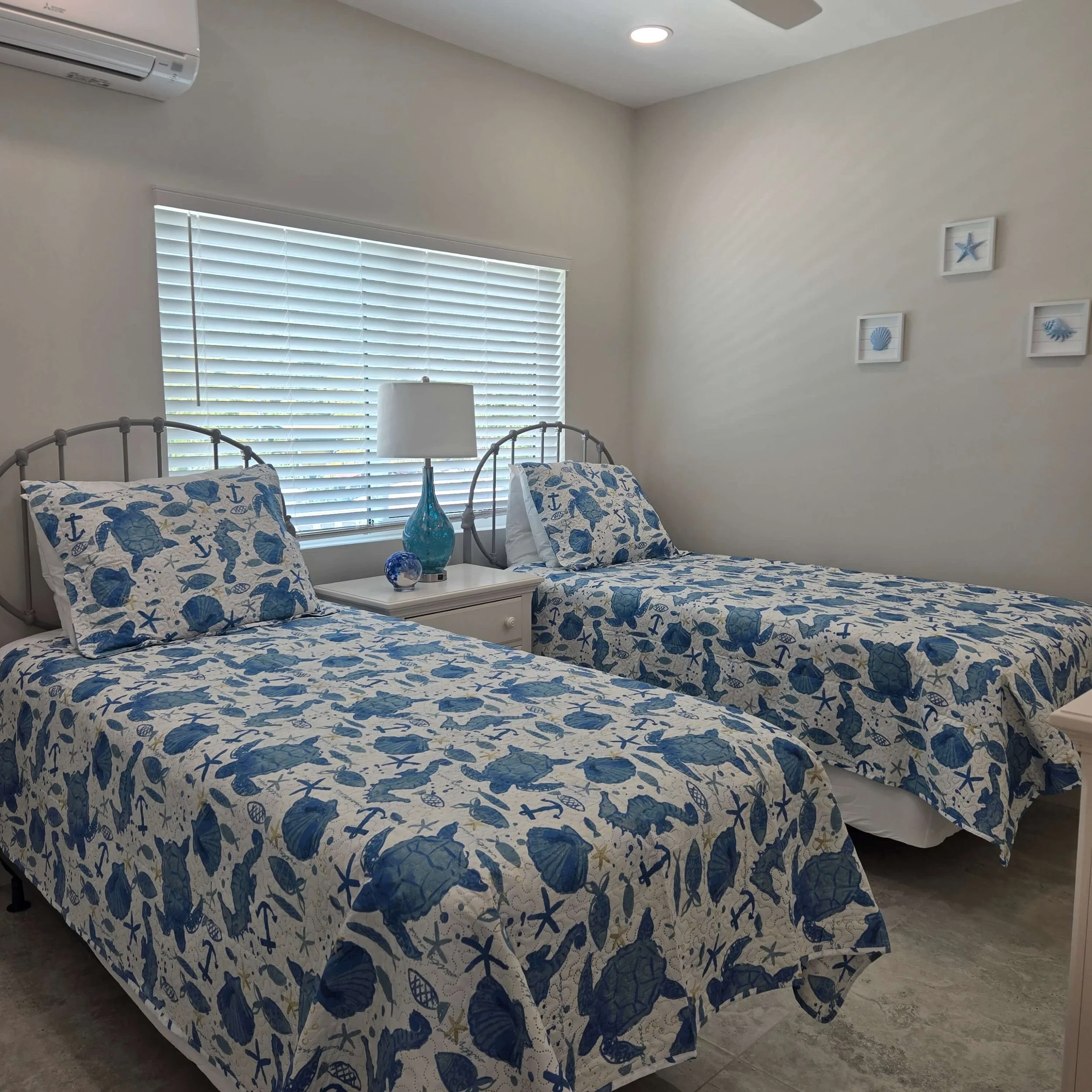 Twin bedroom inside Sea Star vacation rental in Staniel Cay