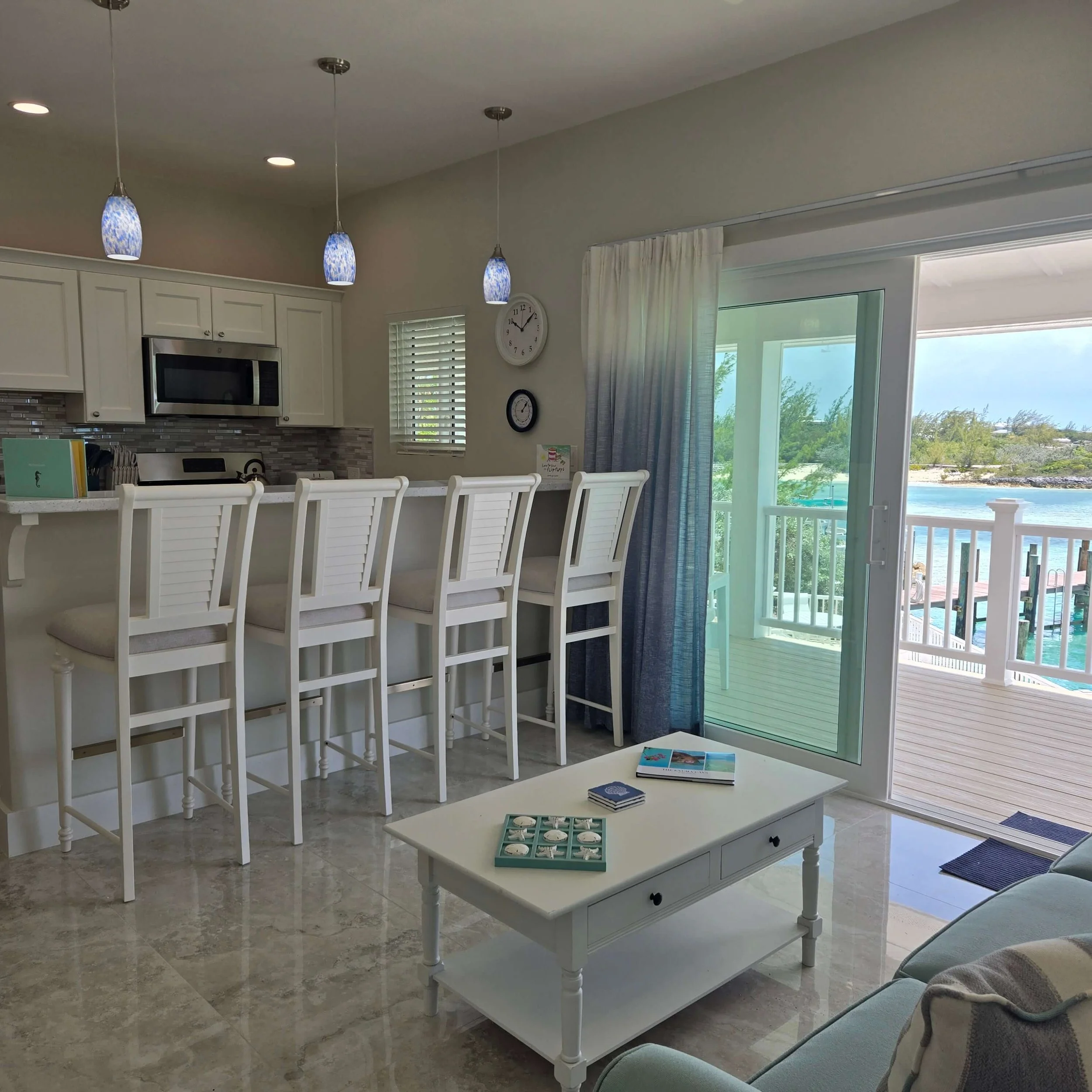 Sea Star vacation rental featuring an open-concept living room and kitchen and a balcony with ocean views