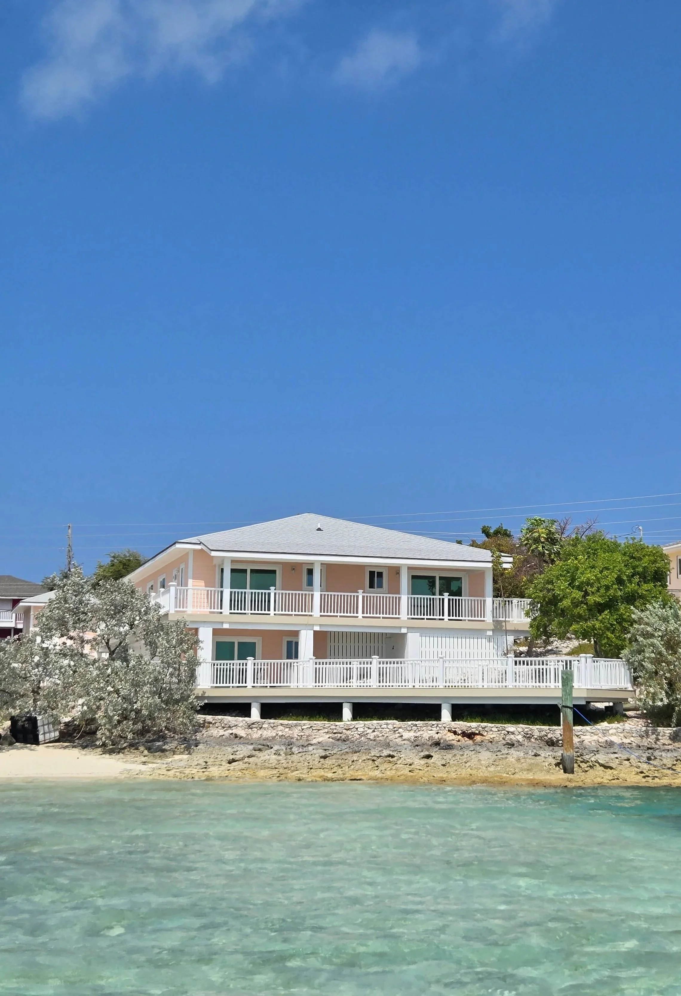 Oceanfront vacation rentals overlooking turquoise water in Staniel Cay, Bahamas