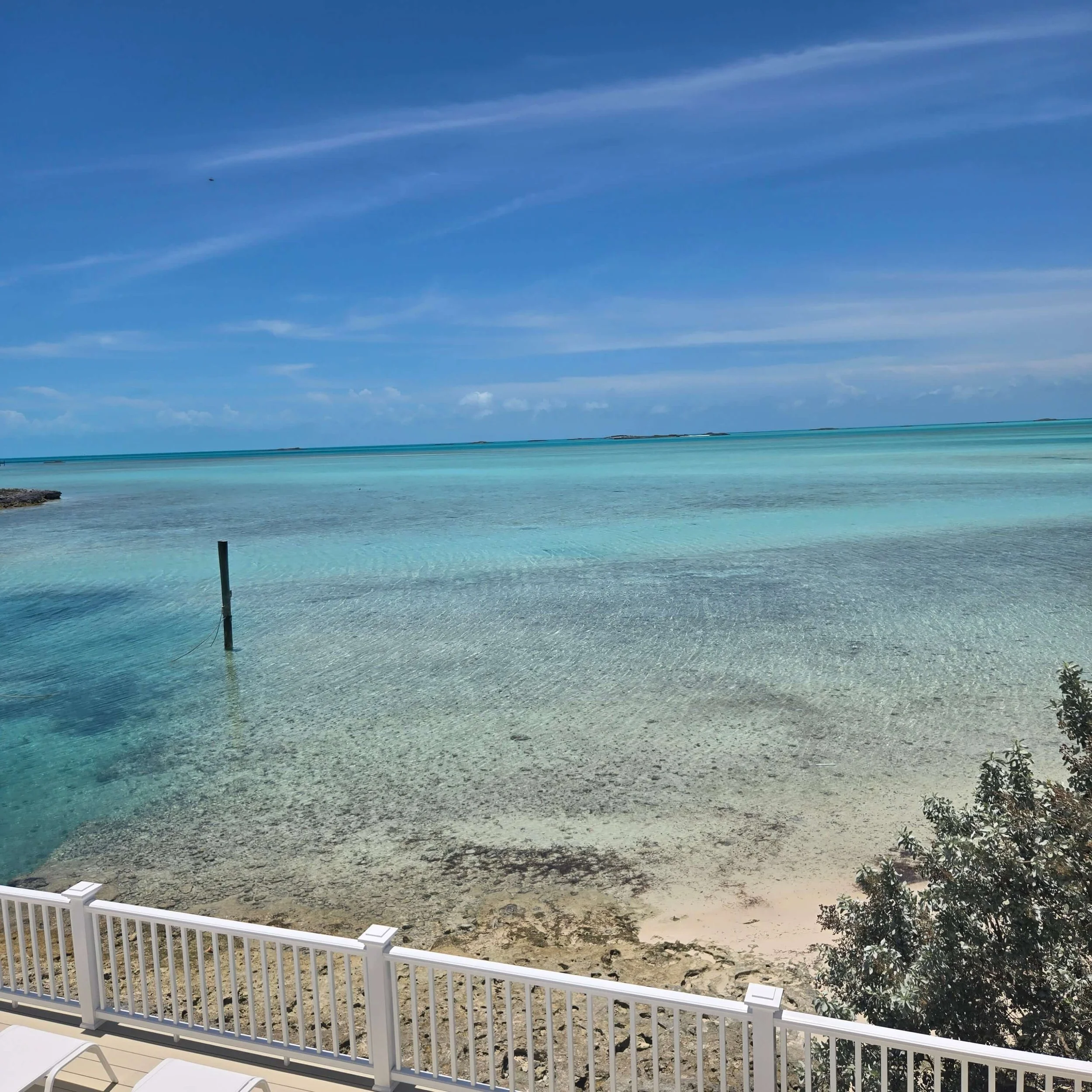 View of Staniel Cay's clear blue ocean and sandy beaches from the Seaside deck.