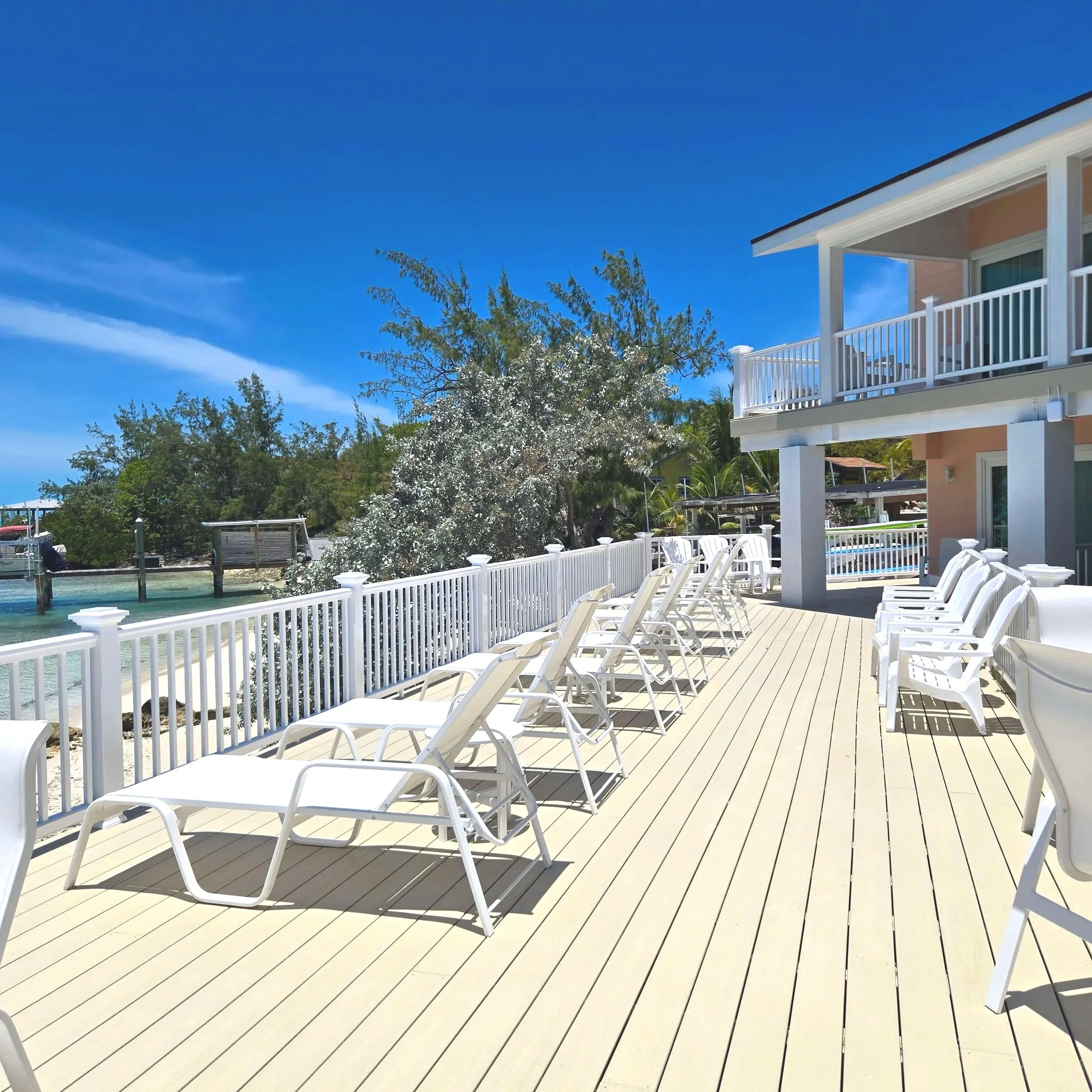 Oceanfront deck with beach access at Seaside Vacation Rentals Staniel Cay