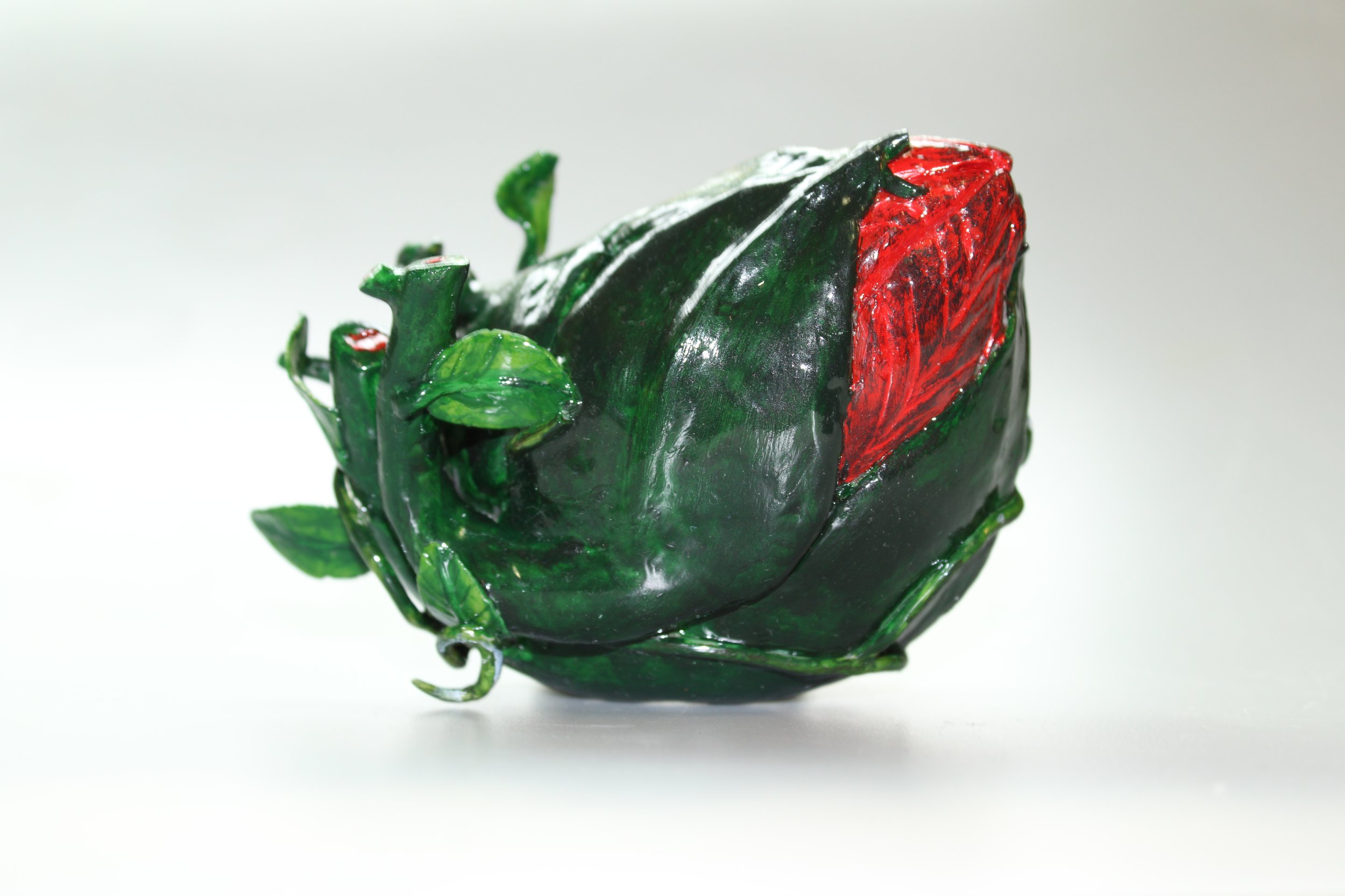 A sculpture of a budding flower shaped to resemble a human heart..