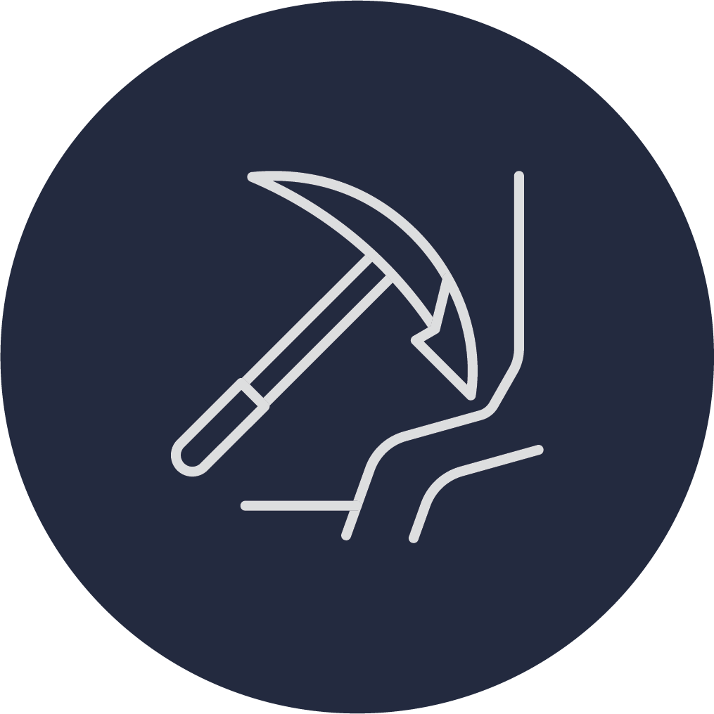Outline icon of a hand holding a pickaxe and a shovel, indicating construction or manual labor.