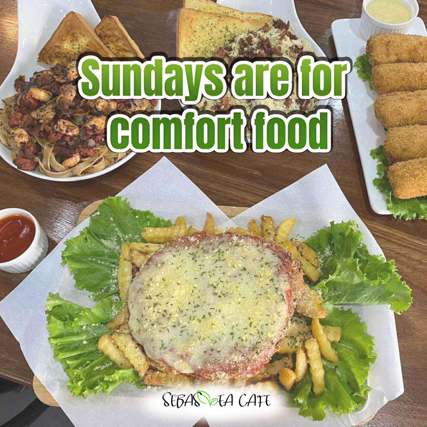Close-up of a plate with French fries topped with melted cheese and herbs, lettuce leaves around, and a slice of tomato. Other dishes on the table include fried food, pizza, garlic bread, and breaded appetizers, with dipping sauces, on wooden and white plates.