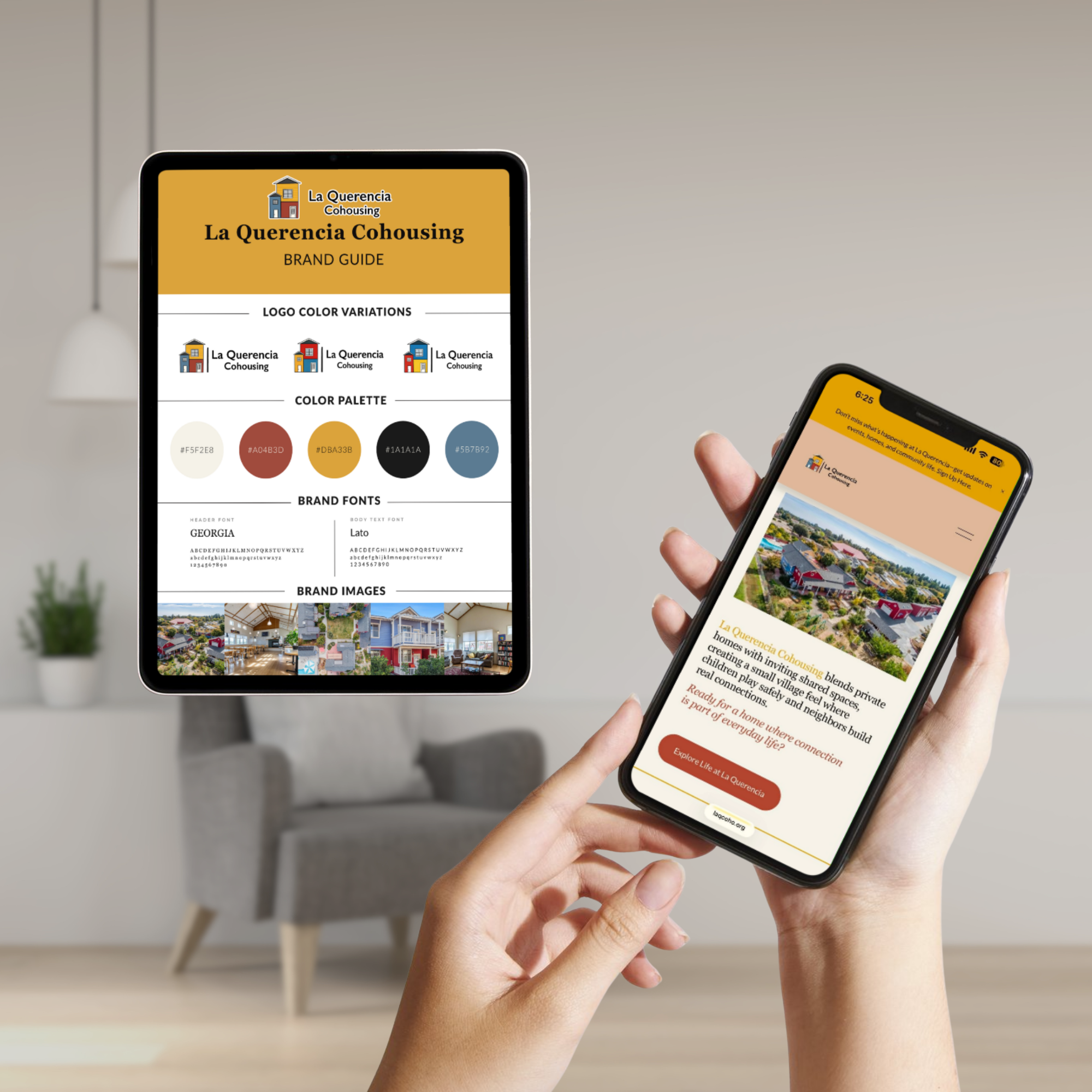 Person holding a smartphone displaying La Querencia Cohousing brand information and logo, with another phone showing a webpage with an aerial view of houses, trees, and streets.