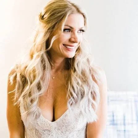 woman wearing a wedding dress and smiling