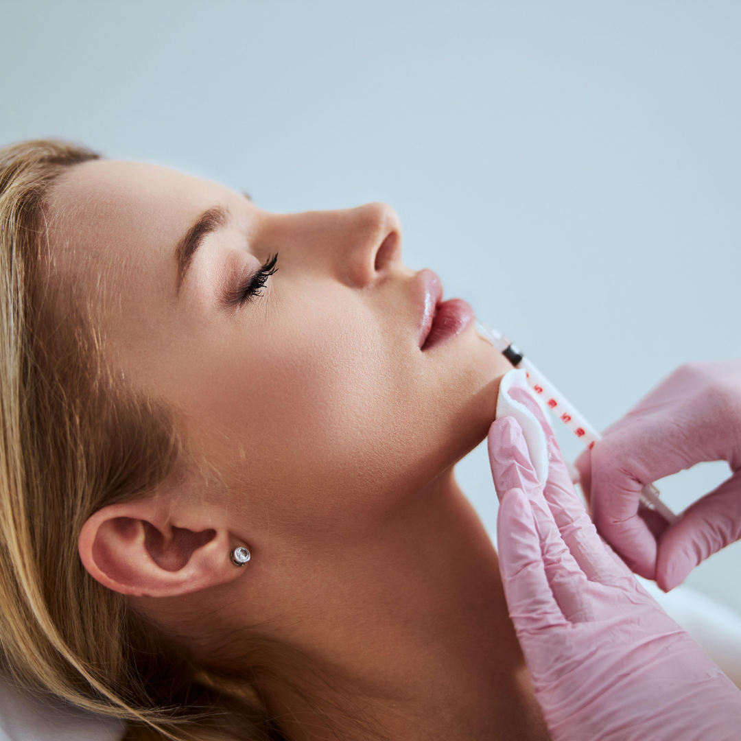 woman receiving lip filler treatment