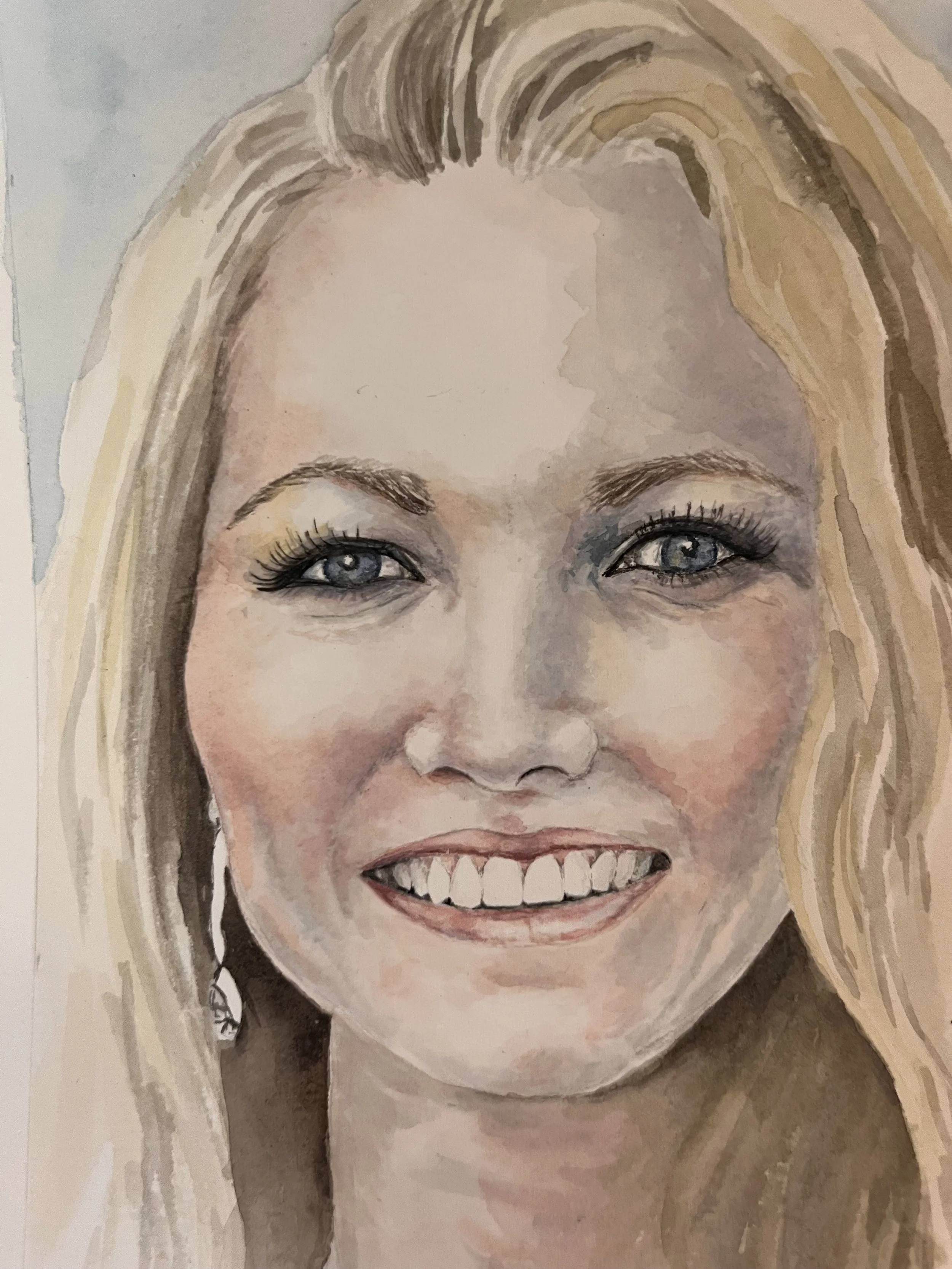 A realistic watercolor portrait of a woman with long blonde hair, blue eyes, and a big smile showing her teeth.
