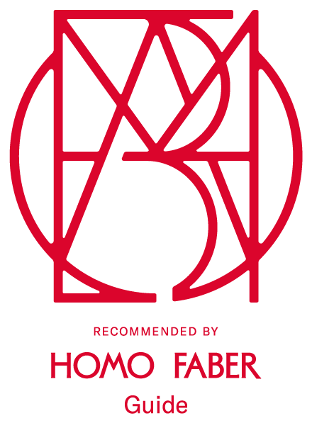 Stylized red geometric logo with the text 'RECOMMENDED BY HOMO FABER Guide' beneath it.