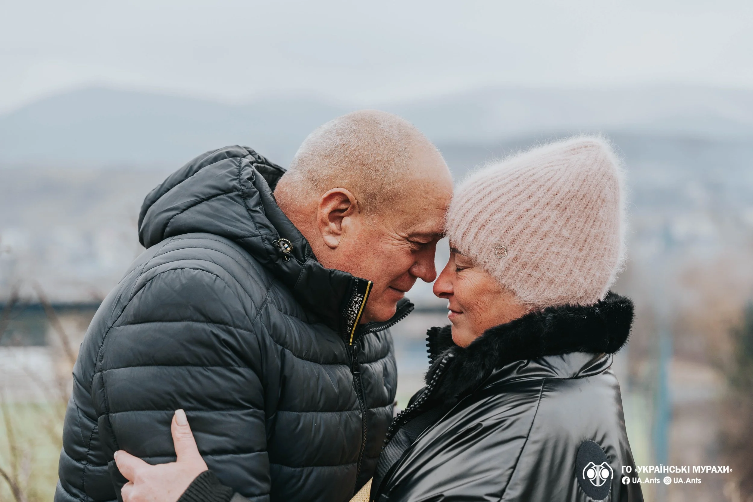 Ukrainian veteran and his wife sharing a moment at a UA Ants camp, supported by US Ants programs for healing and restoration.