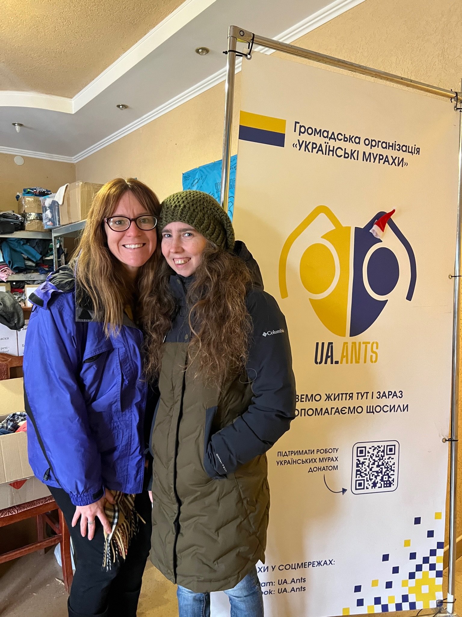 Member of the UA Ants team with a visiting American supporter, representing the connection between UA Ants in Ukraine and US Ants in the United States.