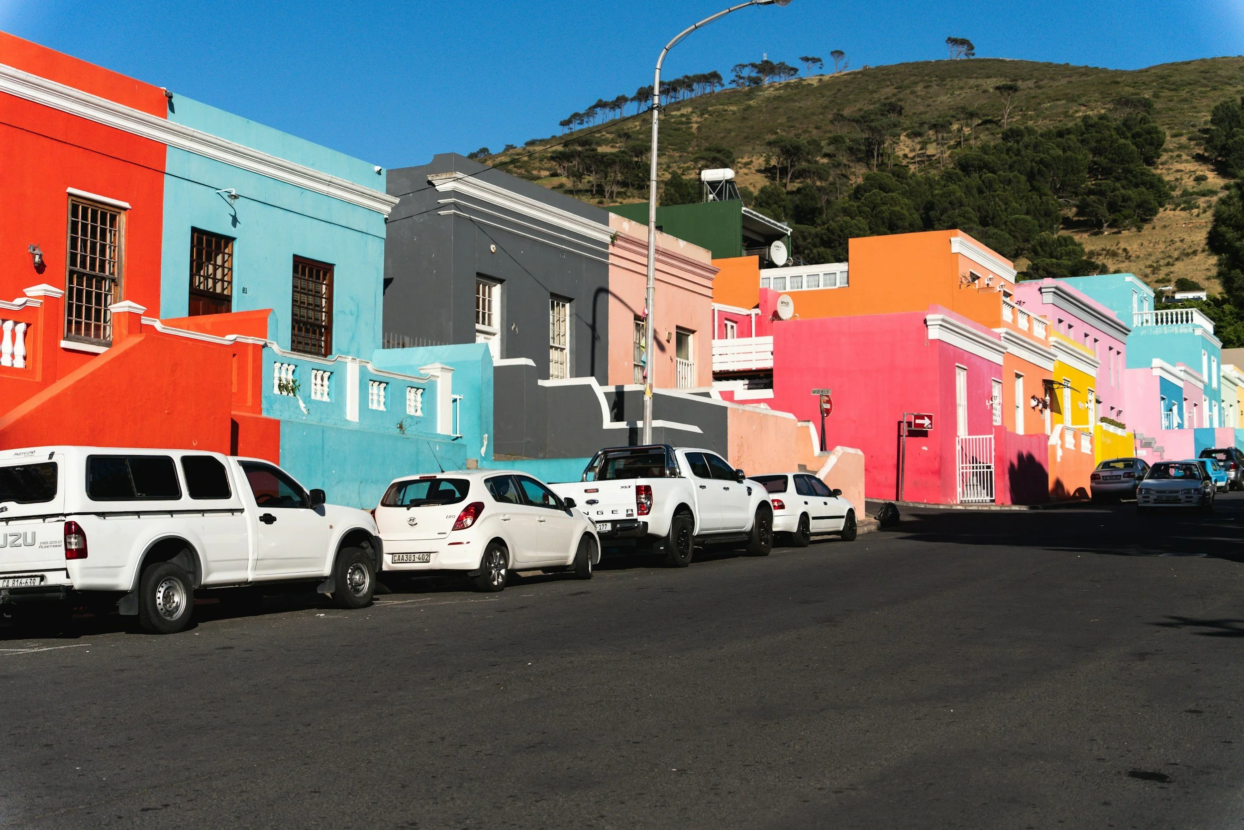 The vibrant, colorful streets of Bo-Kaap in Cape Town, featured as a primary stop on MGG Tours' private city and cultural sightseeing packages.