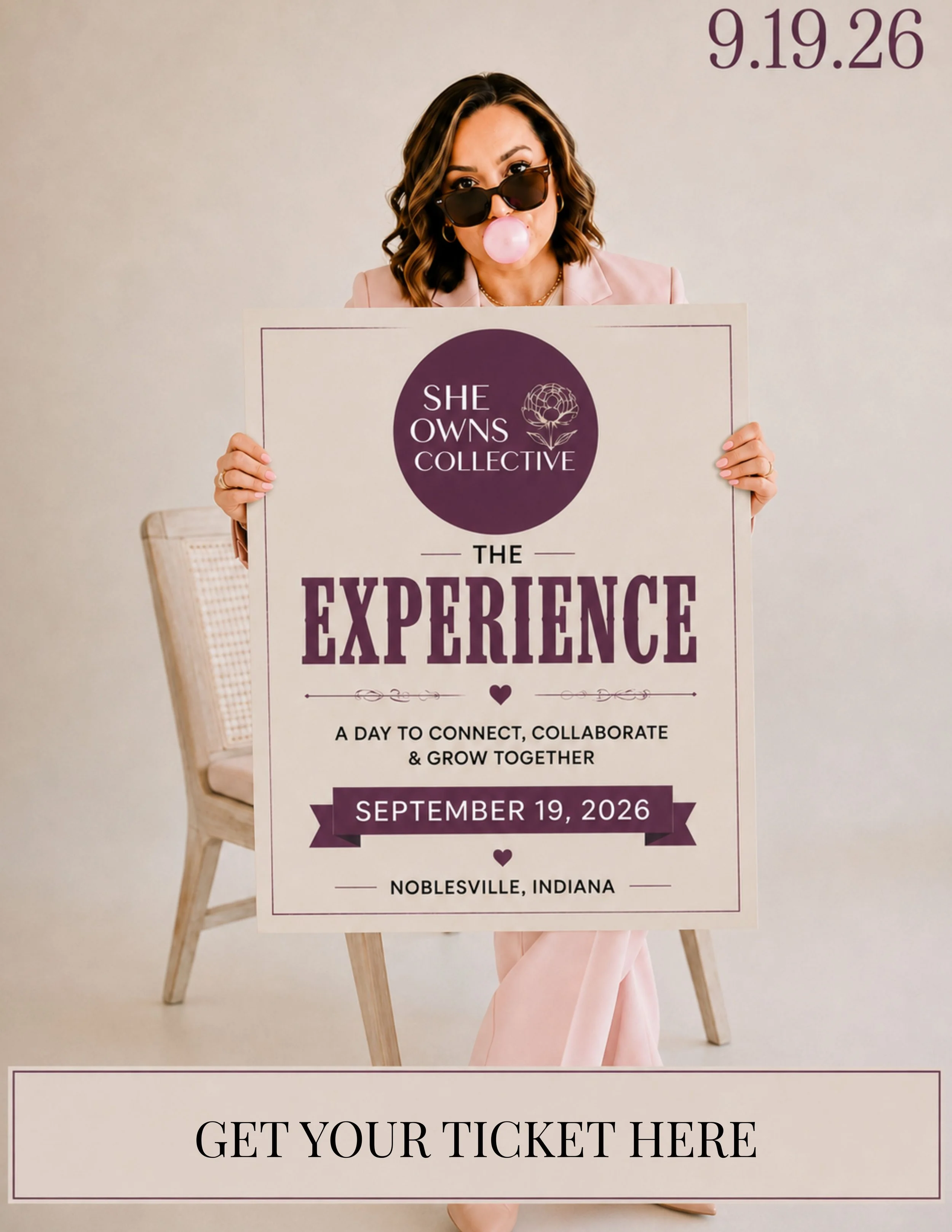 A woman with brown wavy hair wearing sunglasses and blowing a pink bubble gum bubble, holding a ticket for an event on September 19, 2026, in Noblesville, Indiana. She is dressed in a pink blazer and light pink pants, standing in front of a plain light-colored wall with a chair partially visible behind her.