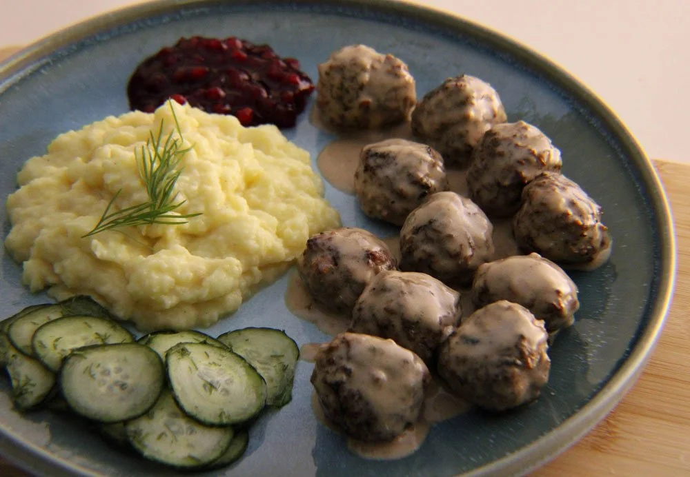 Classic Swedish meatballs in creamy gravy served with mashed potatoes, cucumber salad and lingonberry sauce.