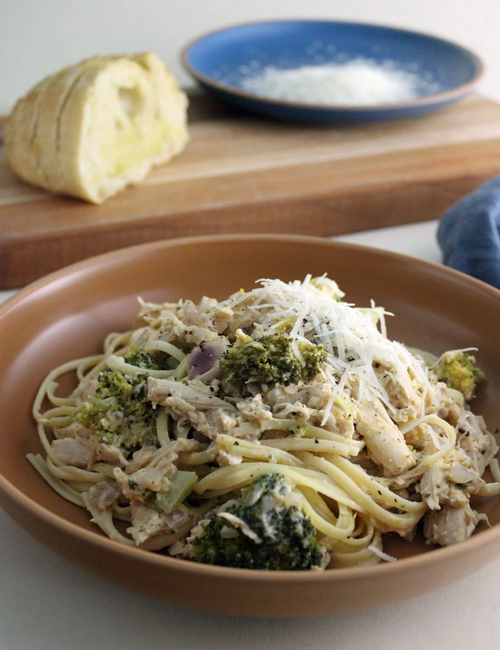 Creamy Chicken Broccoli Pasta with tender roast chicken, broccoli, Parmesan, thyme, and spaghetti in a light creamy sauce.