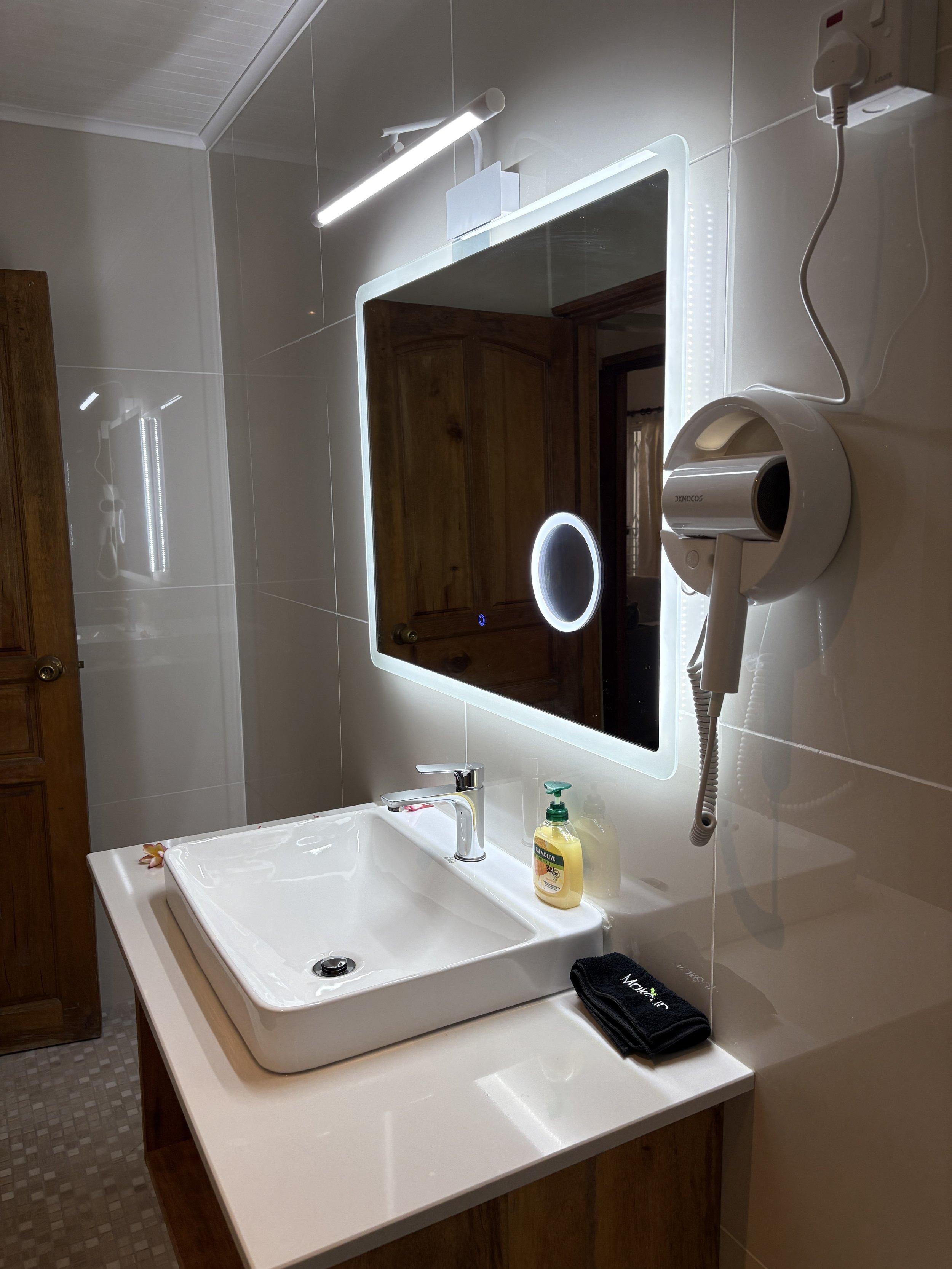 modern clean bathroom with hairdryer.JPG