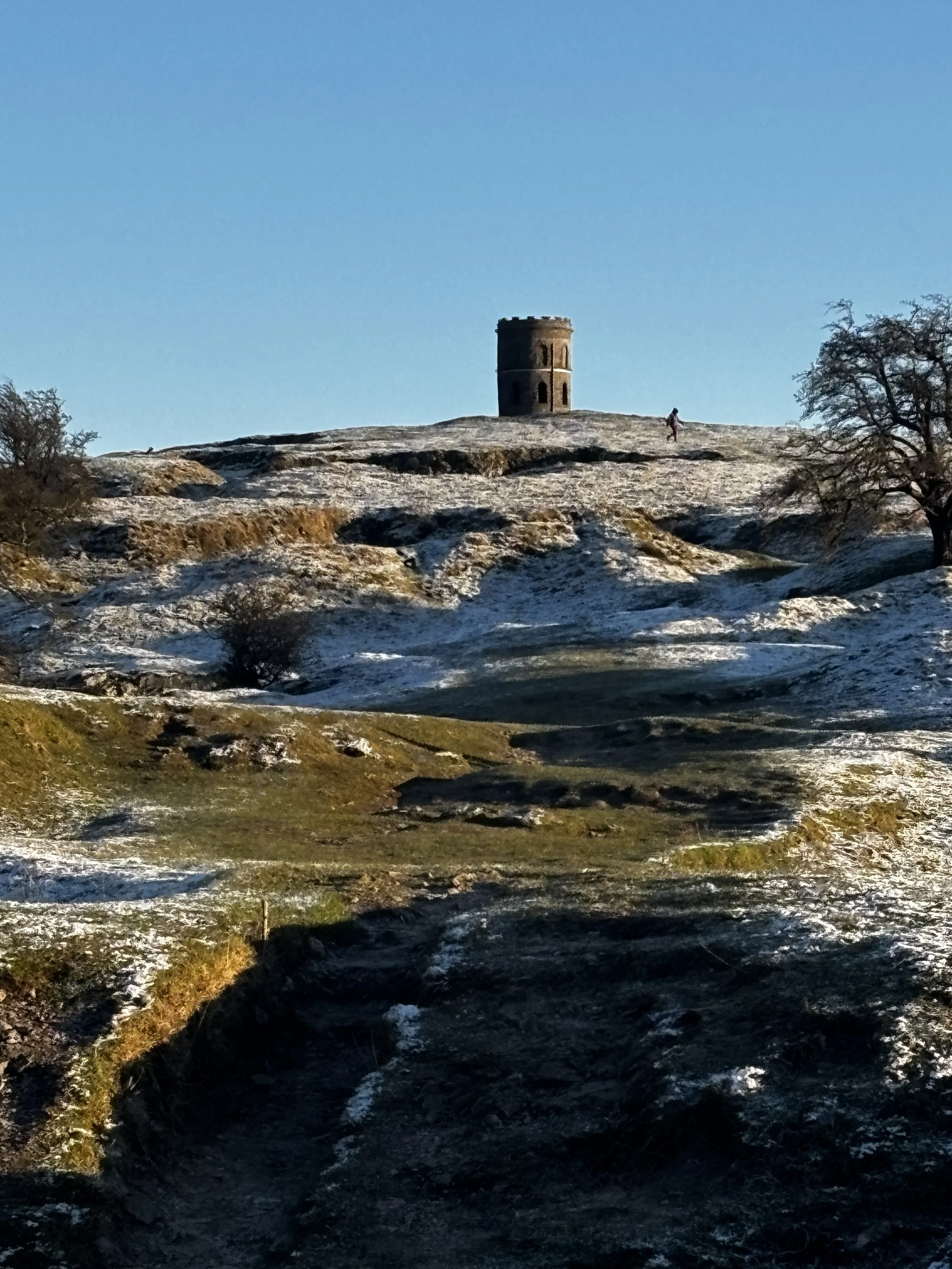 Solomon's Temple. Peak District winter walks, snowy Peak District, Buxton winter breaks, hiking in Derbyshire, National Park trails. Dog-friendly winter hiking, group walking holiday, winter staycation UK, scenic countryside, hill walking Buxton.
