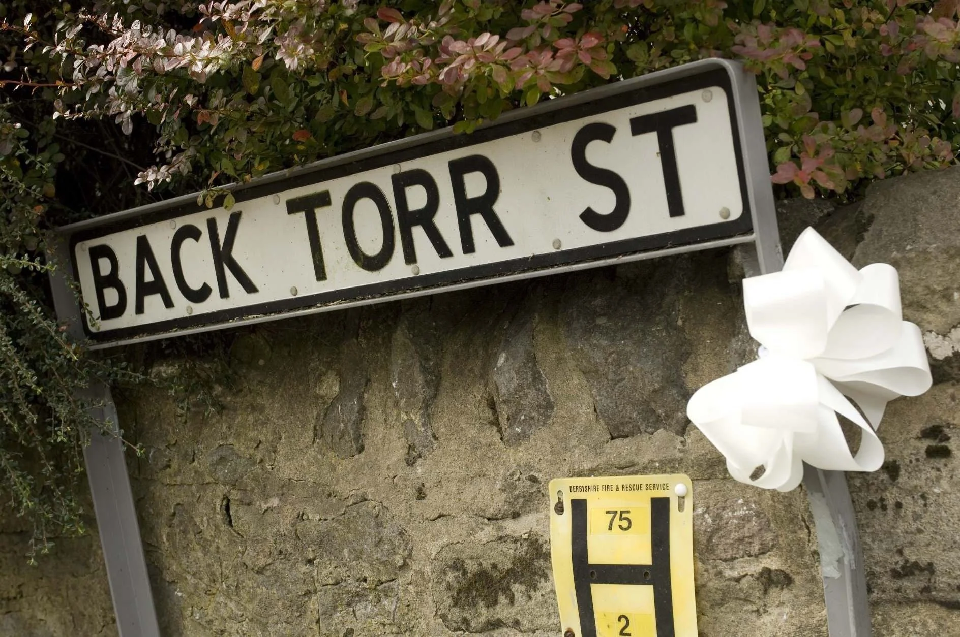 A view of the quiet, historic lane where The Old Stables is located, just a 5-minute walk from Buxton Market Square and the Pavilion Gardens. 