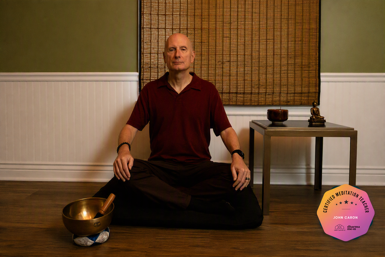 Image of John leading a meditation session in a group setting. Superimposed on the image is a seal of his mindfulness meditation certification.