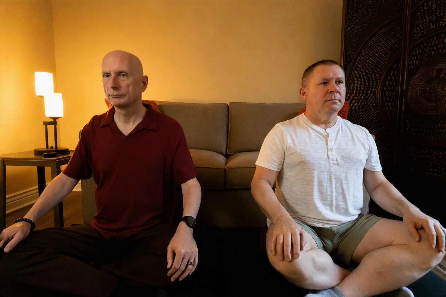 Clickable image of two people in seated meditation.