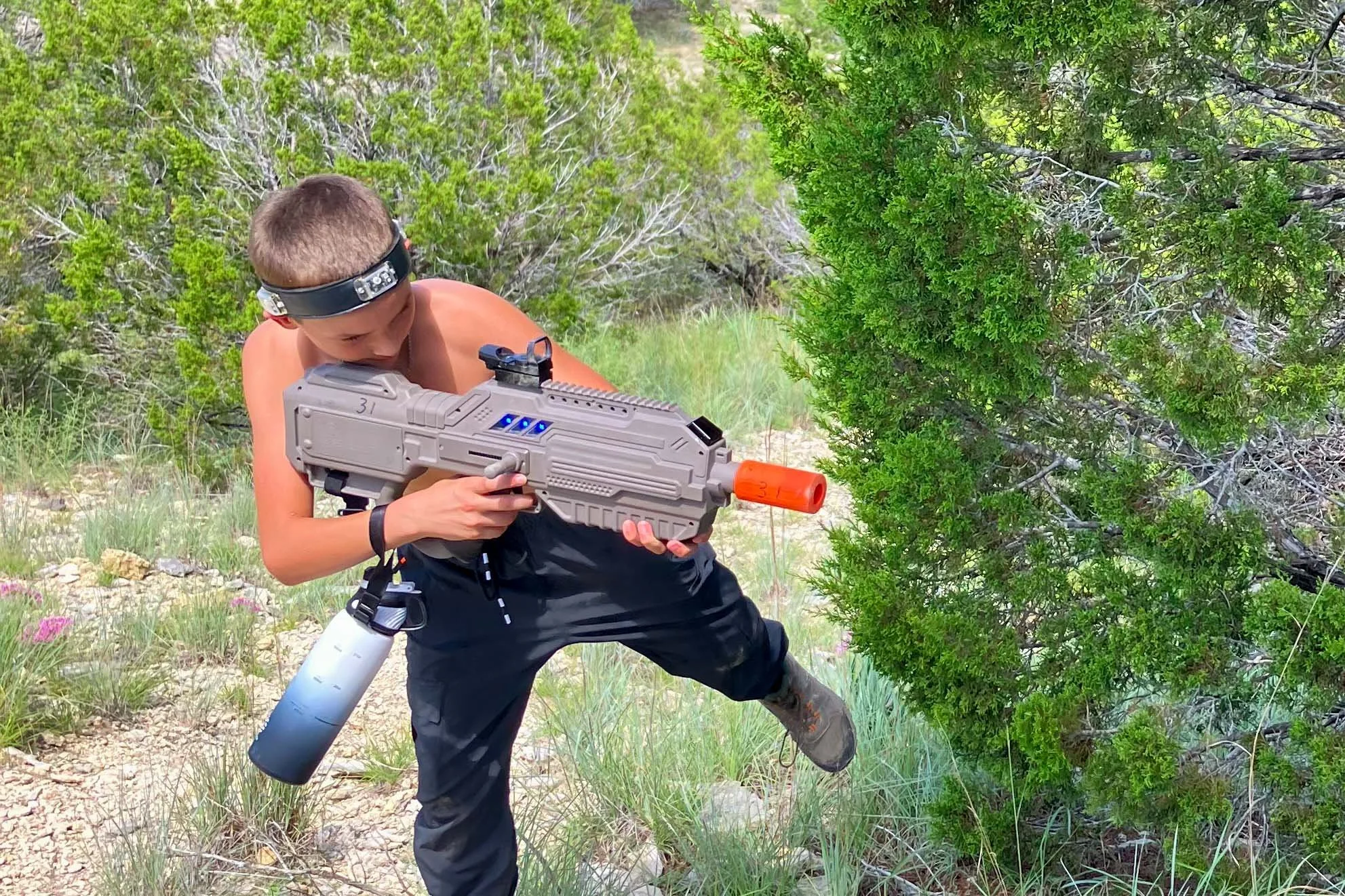 Boy aiming laser tag gun