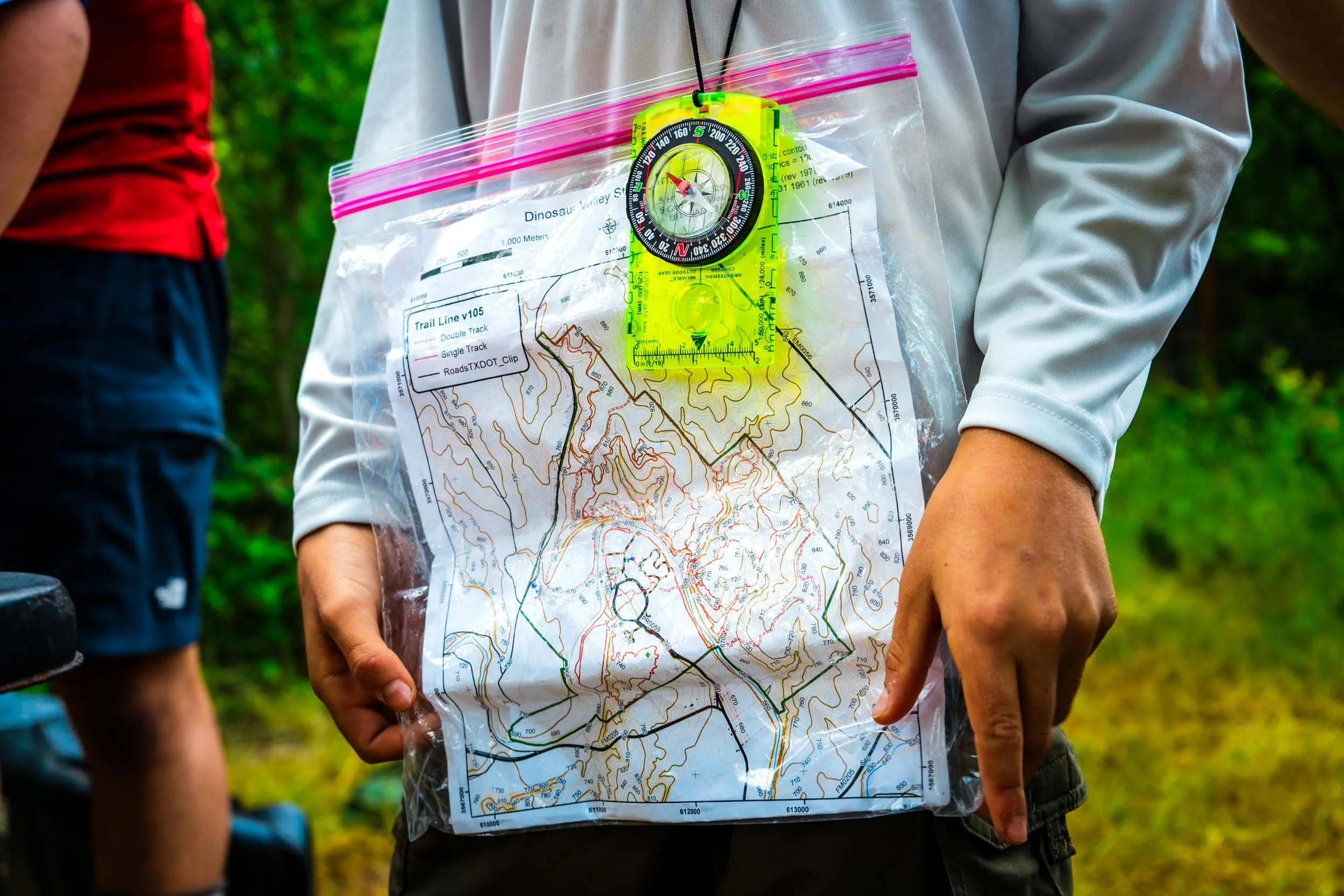 Camper holding a detailed topographic map.