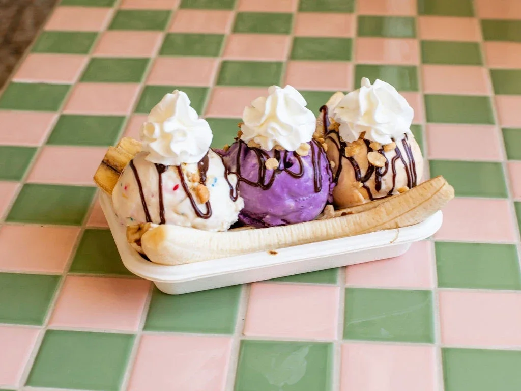 Bananacue banana split with three scoops of ice cream, peanuts, hot fudge, and whipped cream