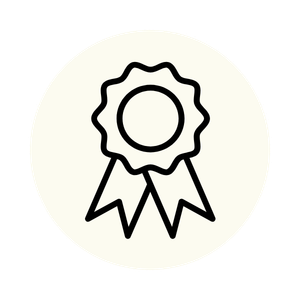 Outline drawing of a medal or award ribbon with a circular top and two hanging ribbons below.