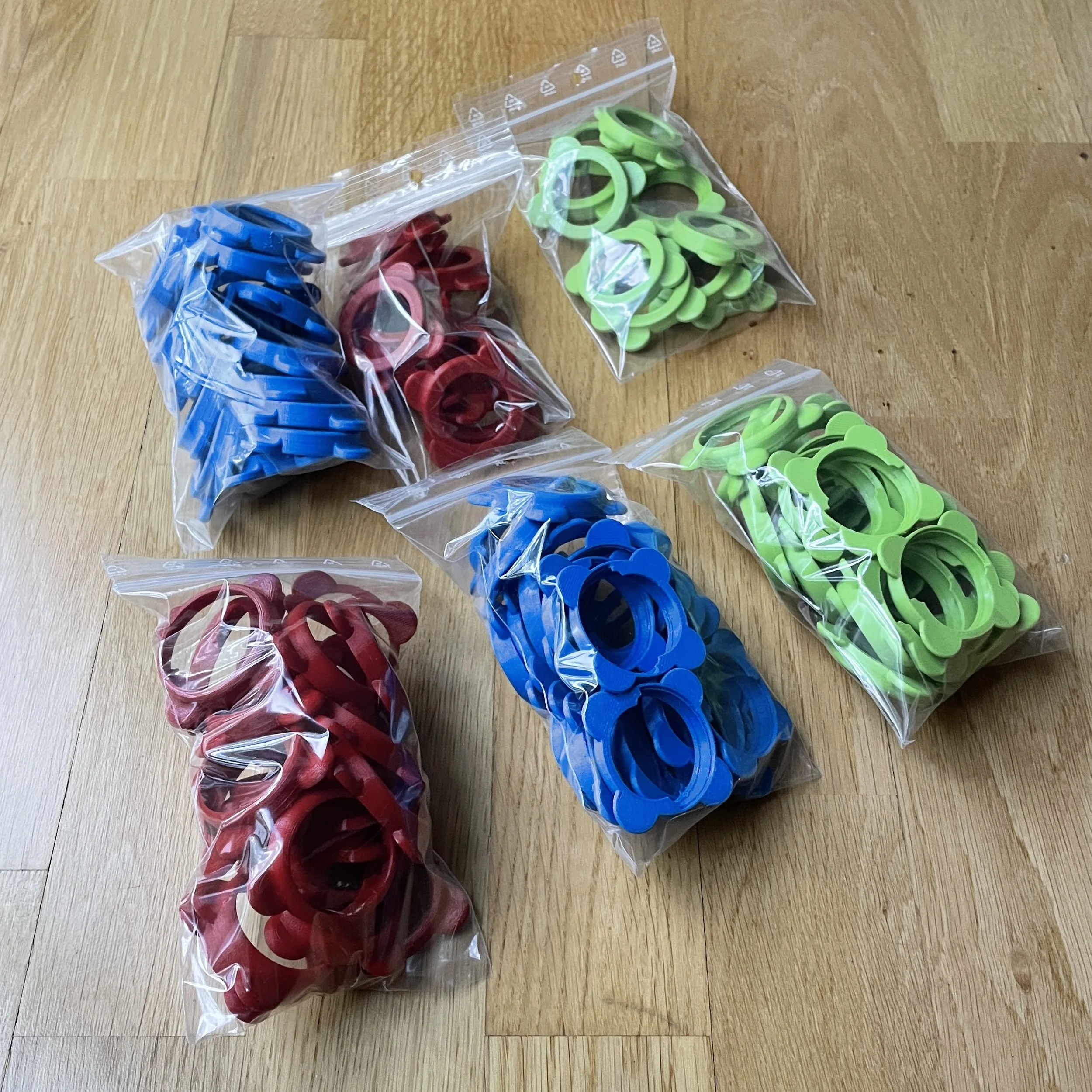 Colourful TPU 3D printed flexible rings in blue, red and green — batch production by Printmaker3D, Sollentuna Sweden