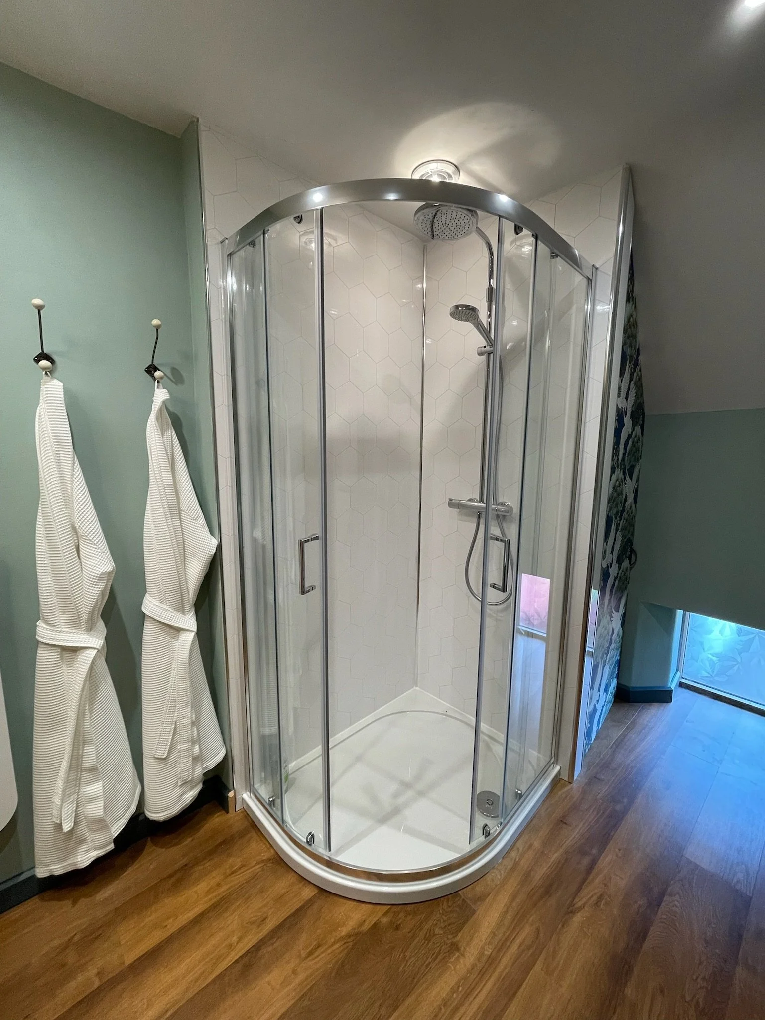 Powerful shower and robes for post-sauna comfort