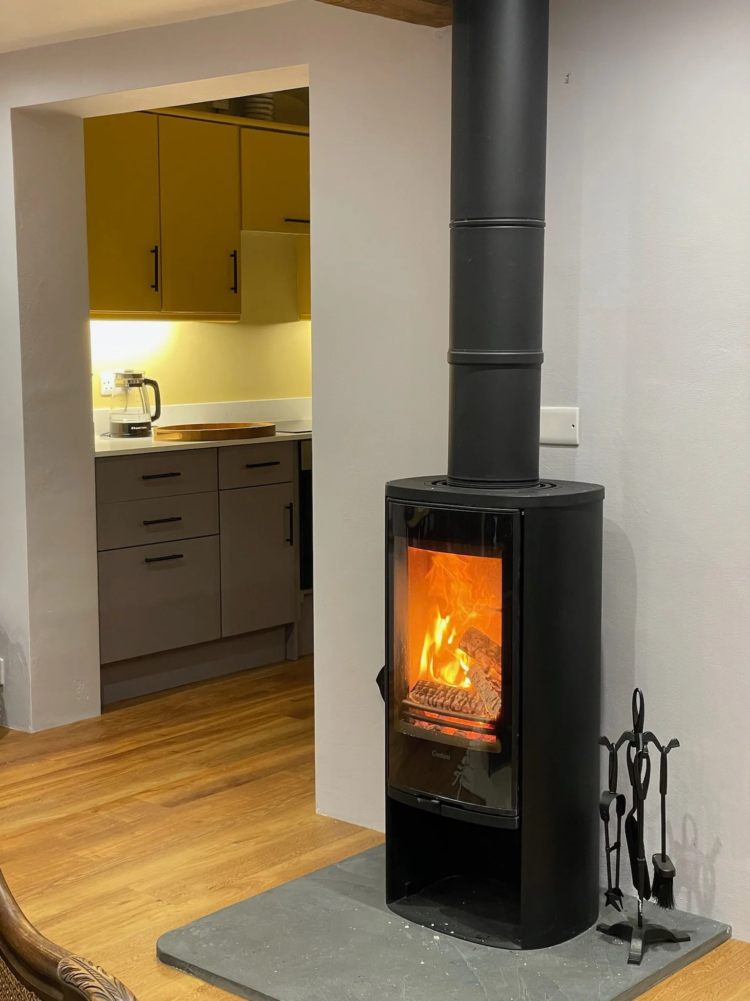 Cosy log burner adds warmth and ambience 