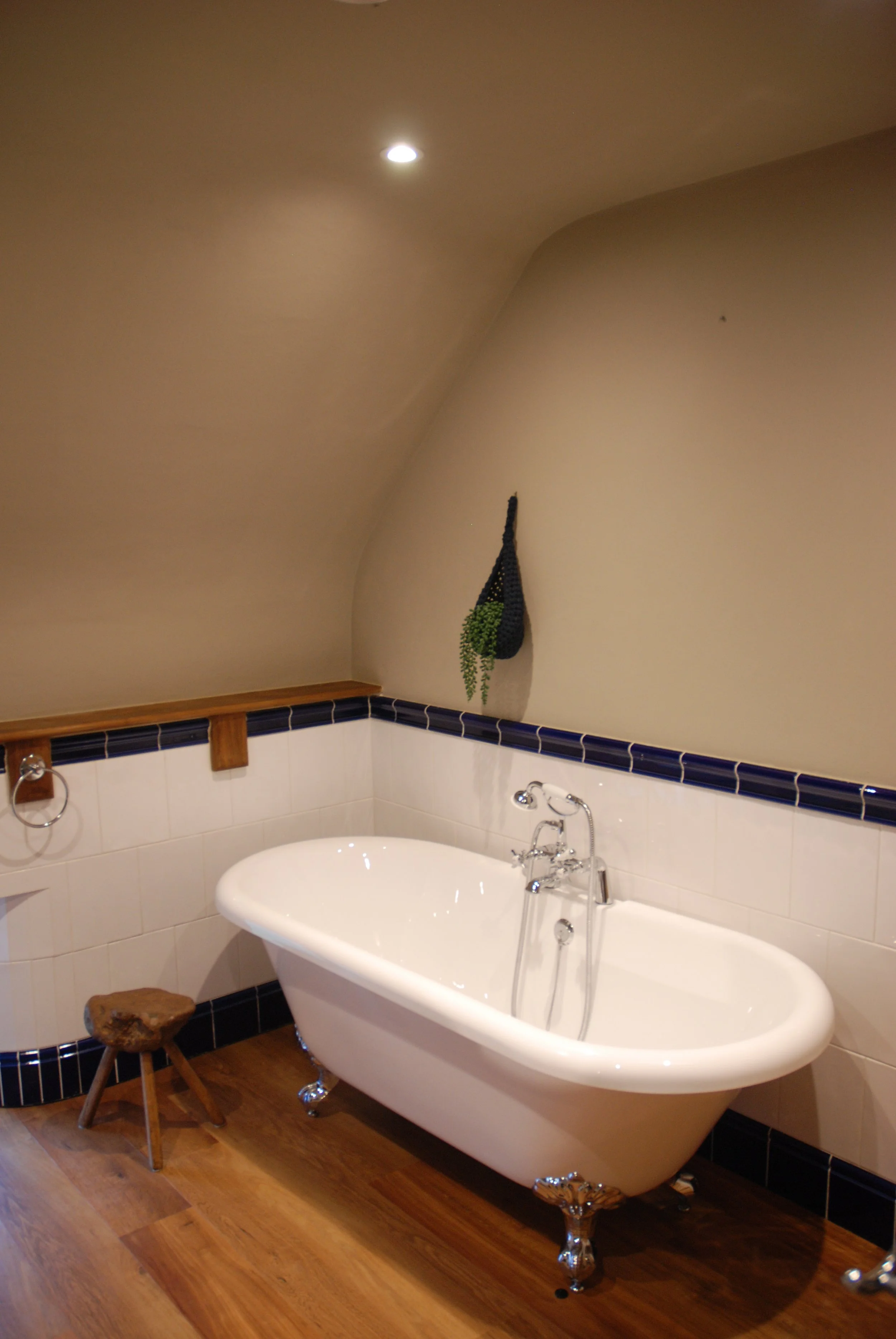 The roll-top bath provides a perfect place to relax and rejuvenate after a full days activity