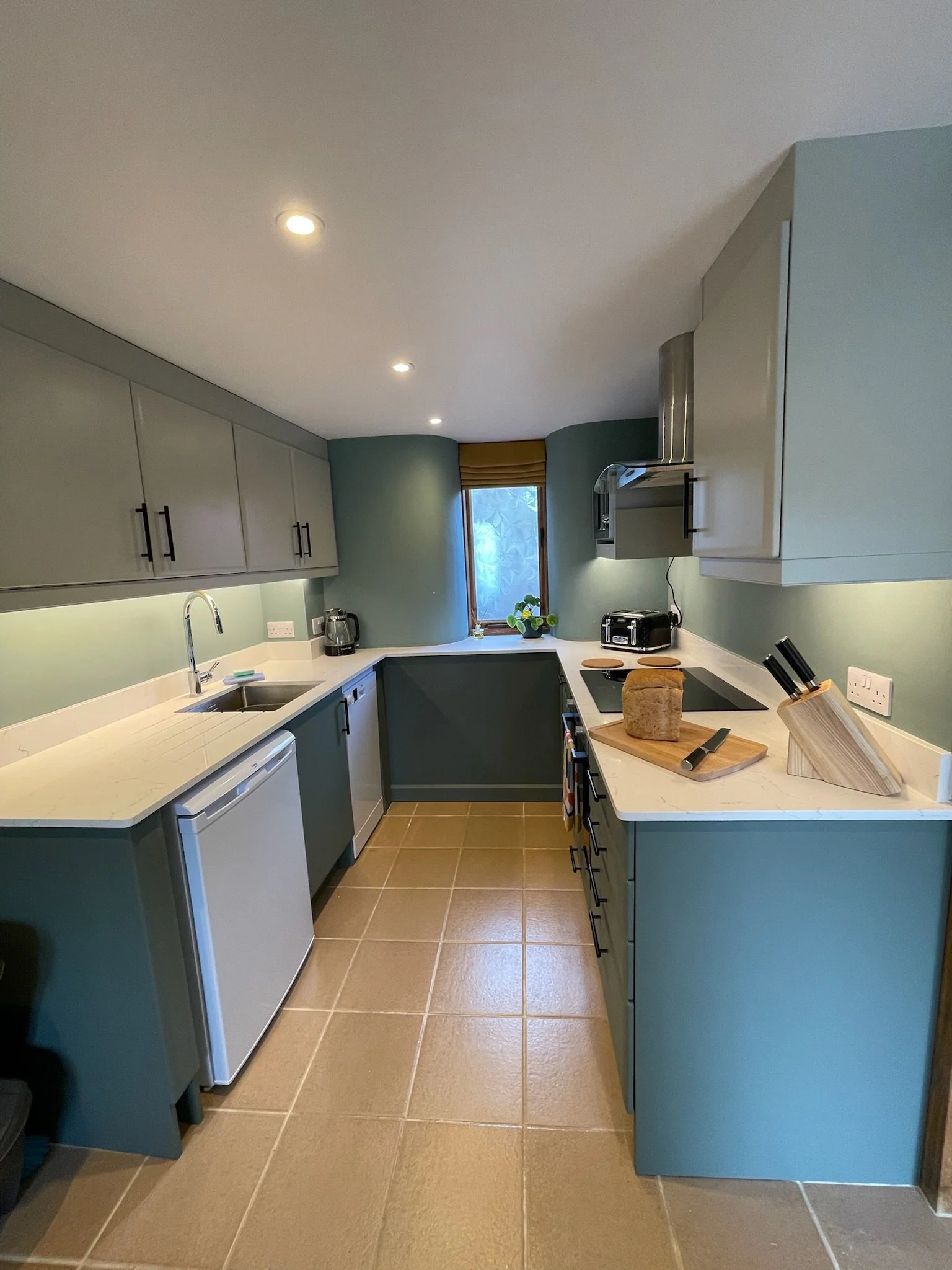 Fully equipped kitchen with fridge and dishwasher