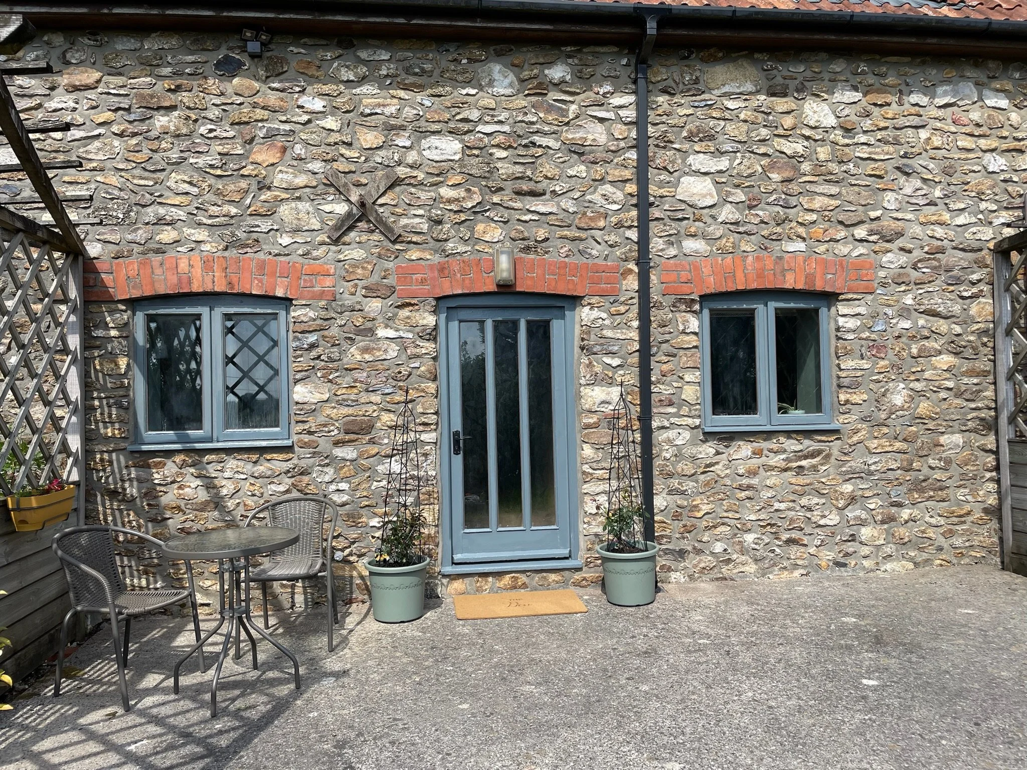 Dedicated outdoor space with seating/dining and charcoal bbq