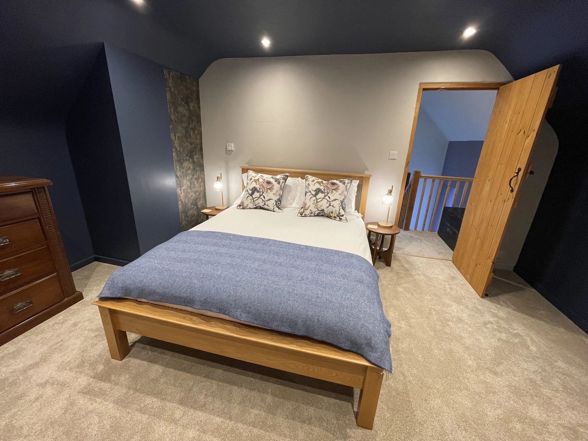 King size bed with white Egyptian cotton sheets in master bedroom