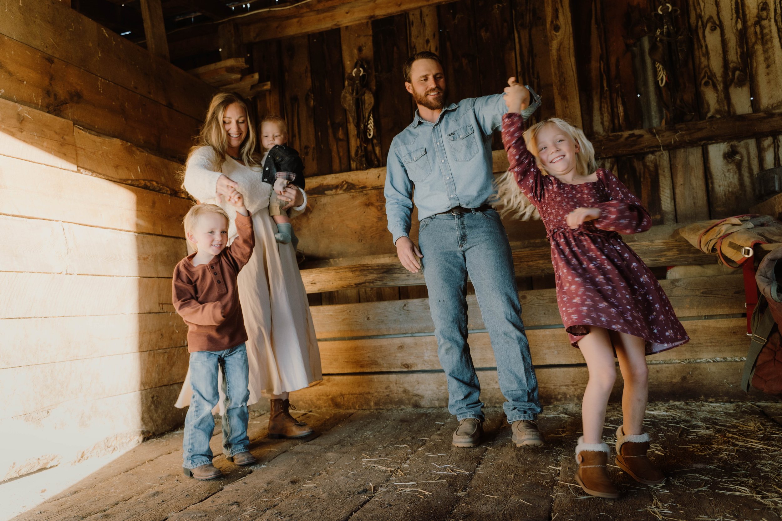 family dancing in barn