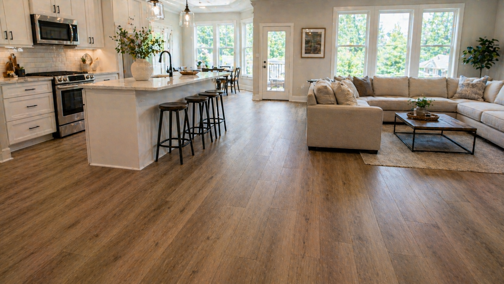 LVP flooring installed seamlessly across kitchen and living room