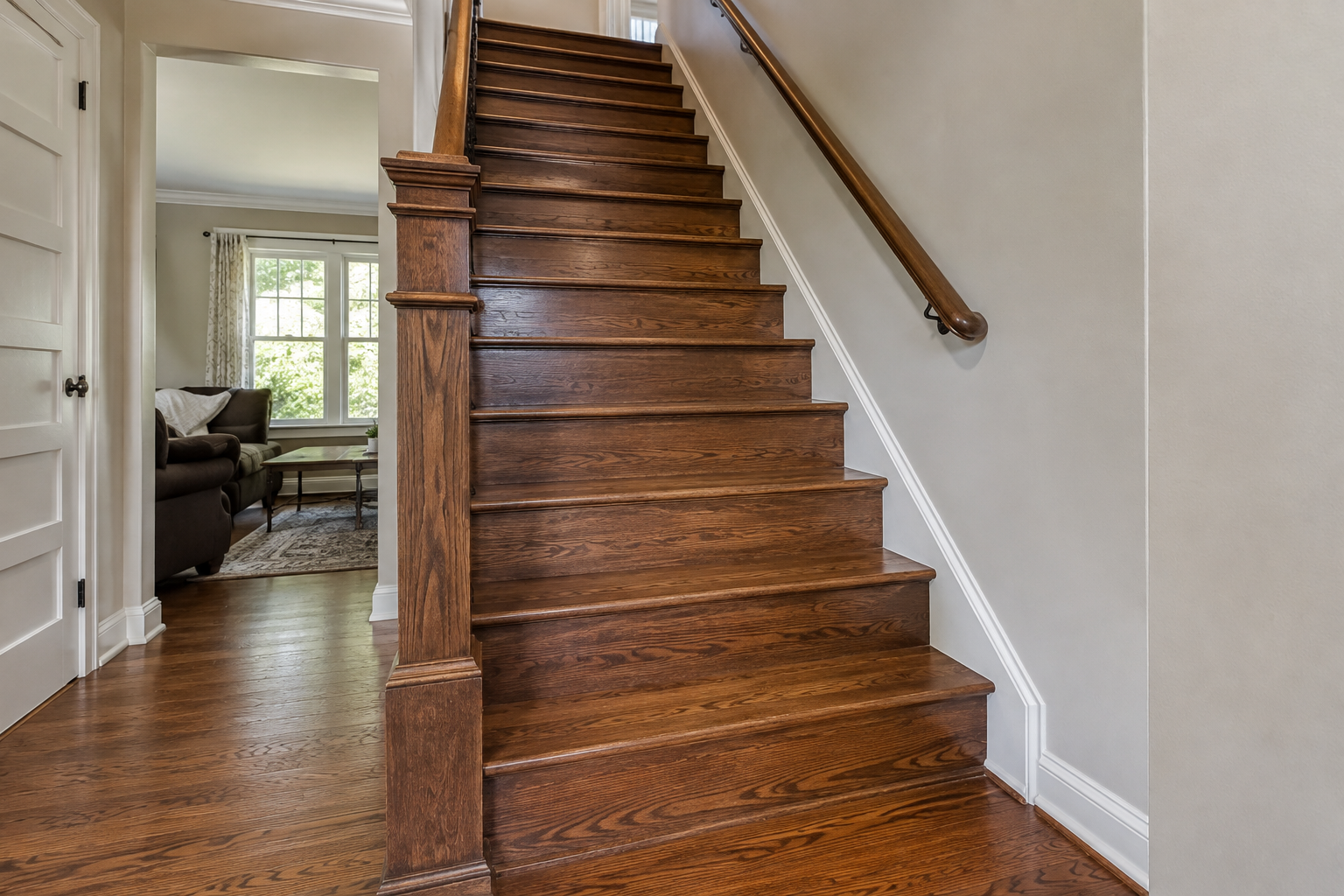 Fully stained red oak stair treads and wood risers in a Kansas City home