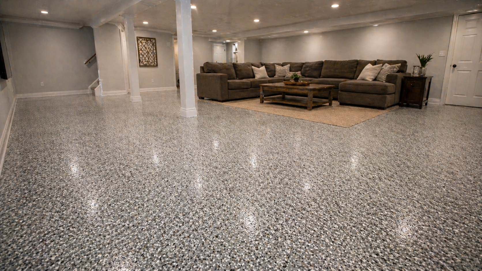 Finished basement with gray flake concrete coating in Kansas City home
