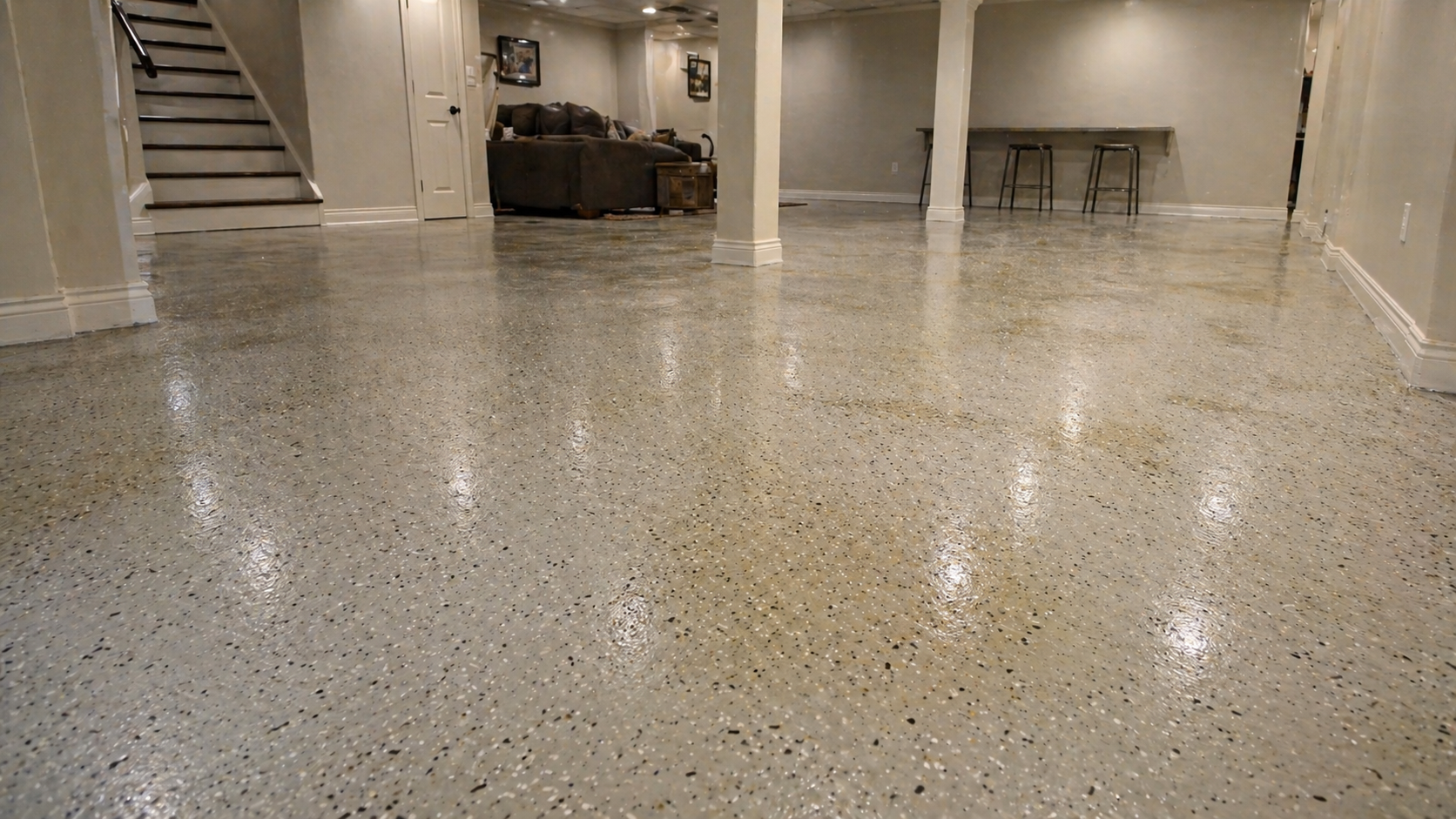Older epoxy basement floor showing yellowing and moisture-related wear