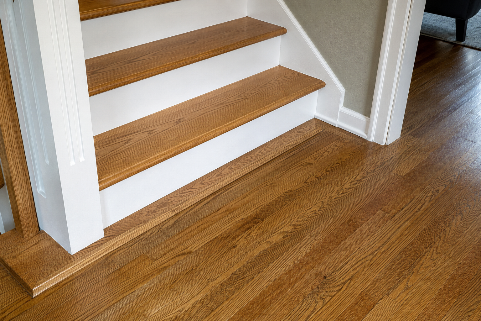 New oak stair treads coordinated with an existing hardwood floor and landing