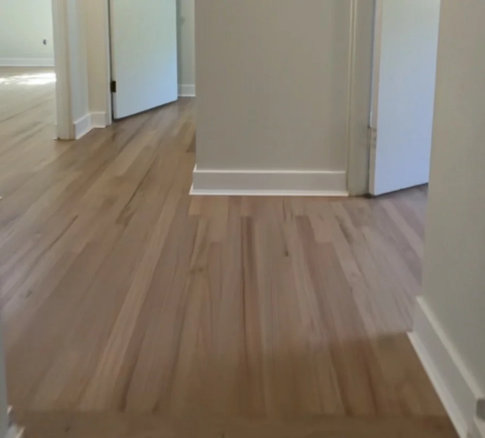 Refinished hardwood continuing through doorways in an Overland Park home