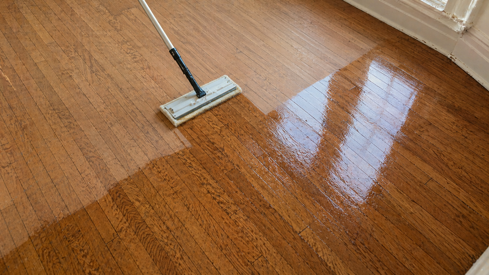 Cleaning and preparing an existing hardwood floor for recoating