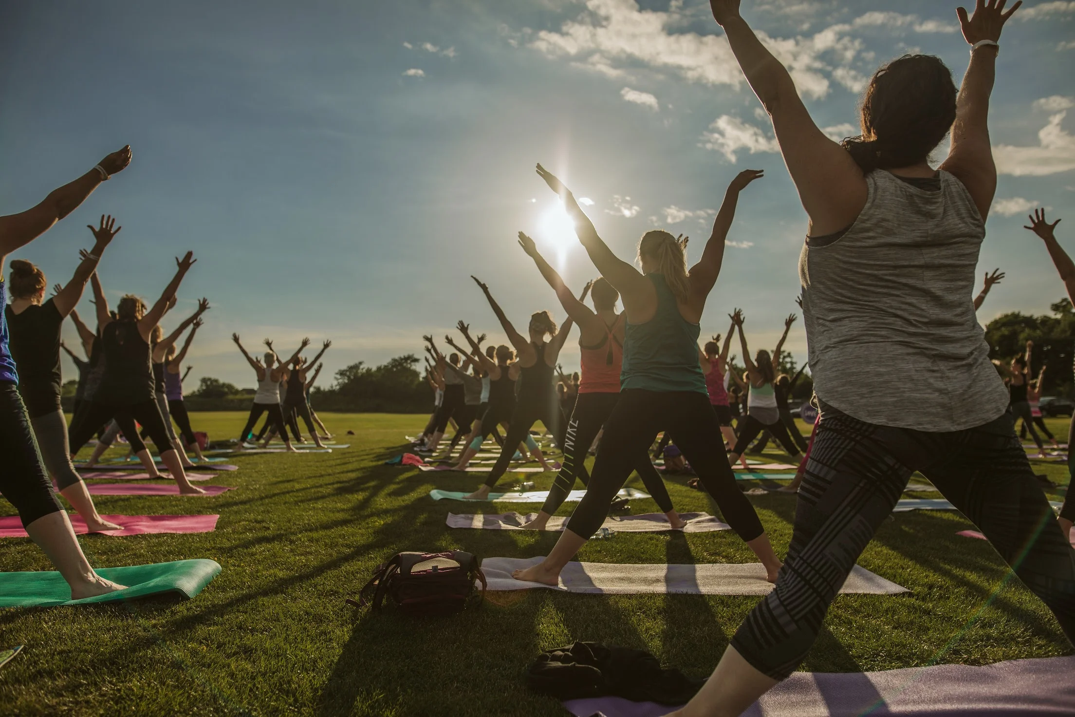 yoga class at sunset on the grass of Arranmore Farm and Polo Club