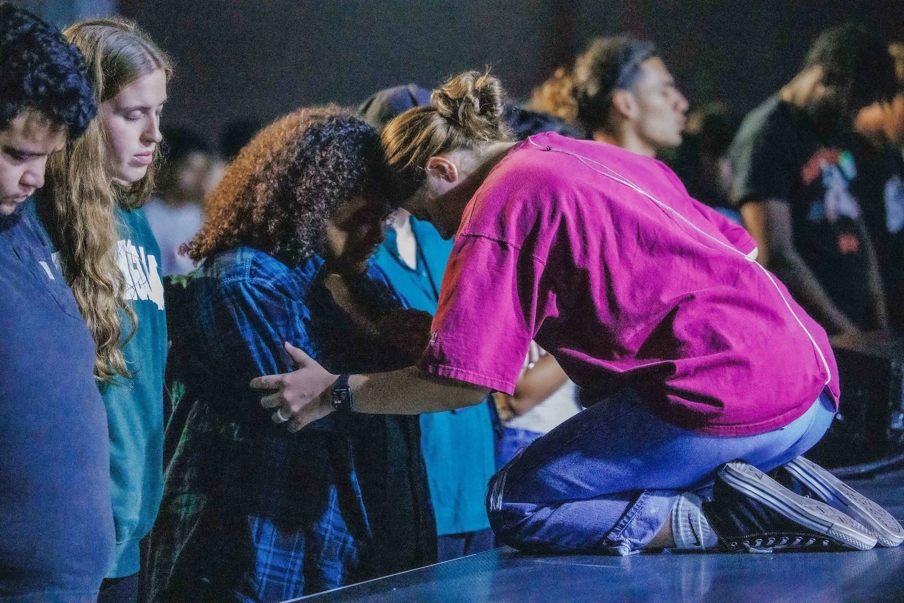 Students praying together at a PSYTH youth night at Pearl Street Church