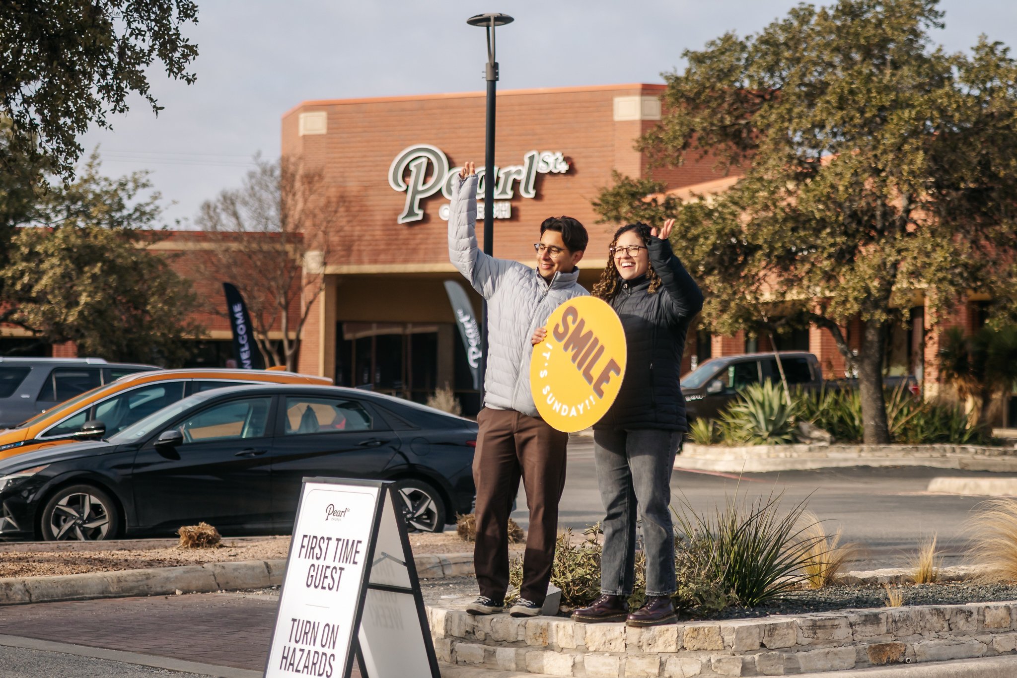 Parking team greeting first-time guests in the lot at Pearl Street Church North in Hollywood Park