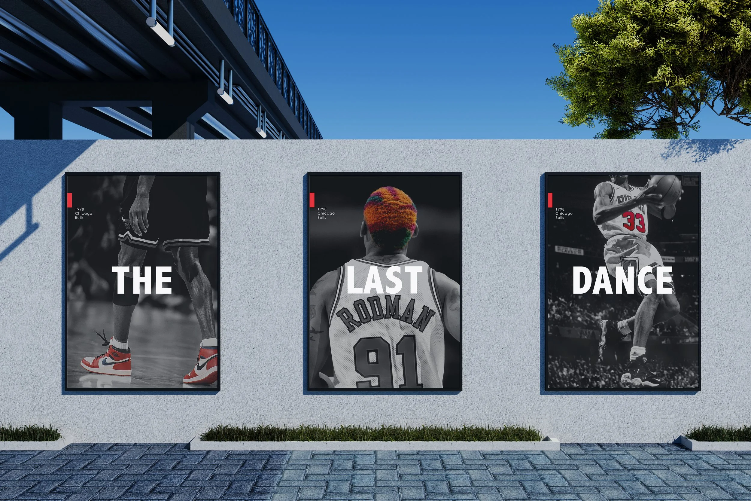 Three large posters on a white wall featuring black and white images of basketball players. The posters have bold white text overlaying the images: the first says 'THE', the second 'LAST' with a player wearing a jersey that says 'RODMAN 91', and the third 'DANCE' showing a player in mid-air with a basketball.