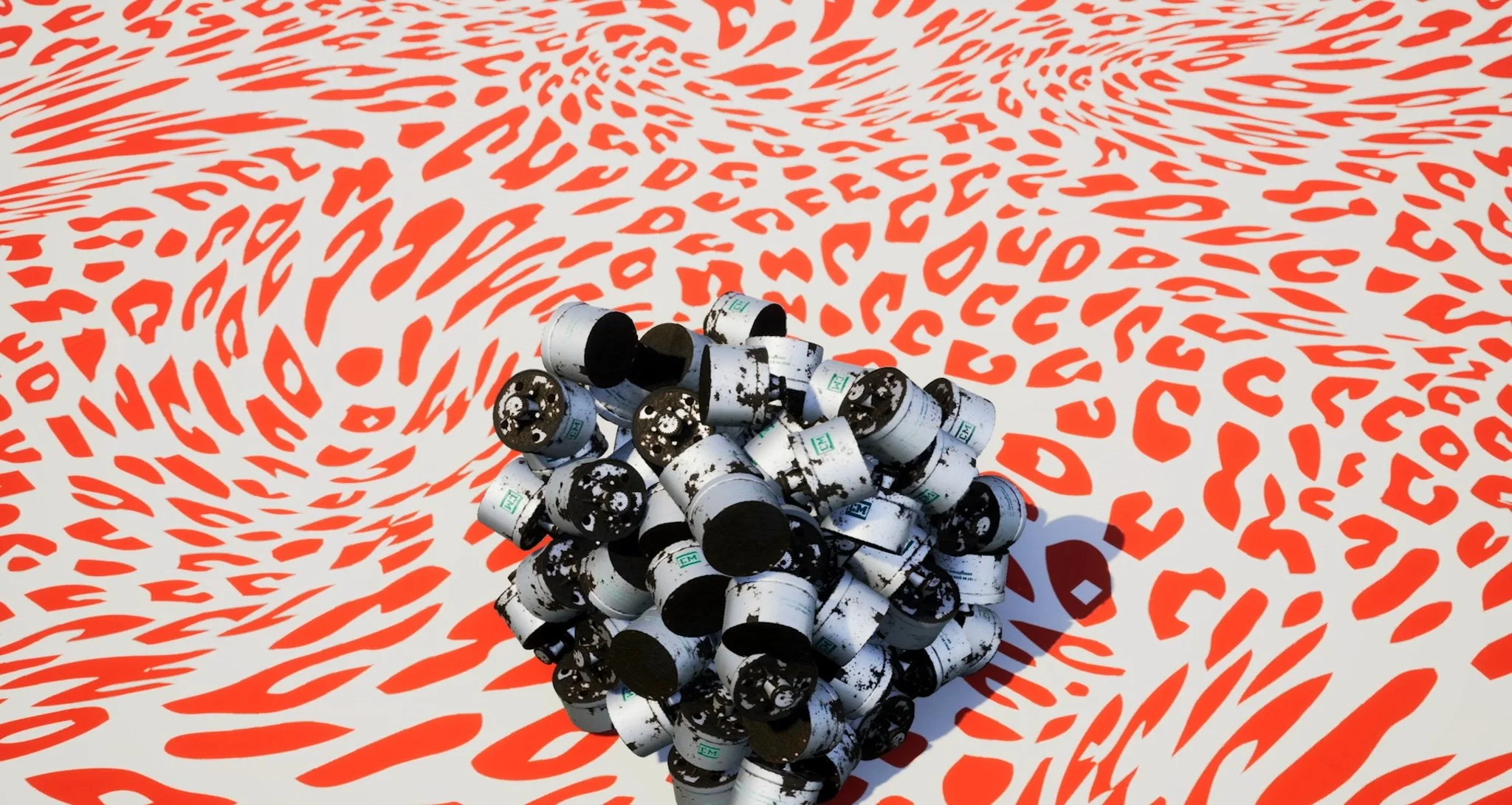 A 3D rendering of a pile of black and white tear gas canisters on a surface with red and white painted patterns.